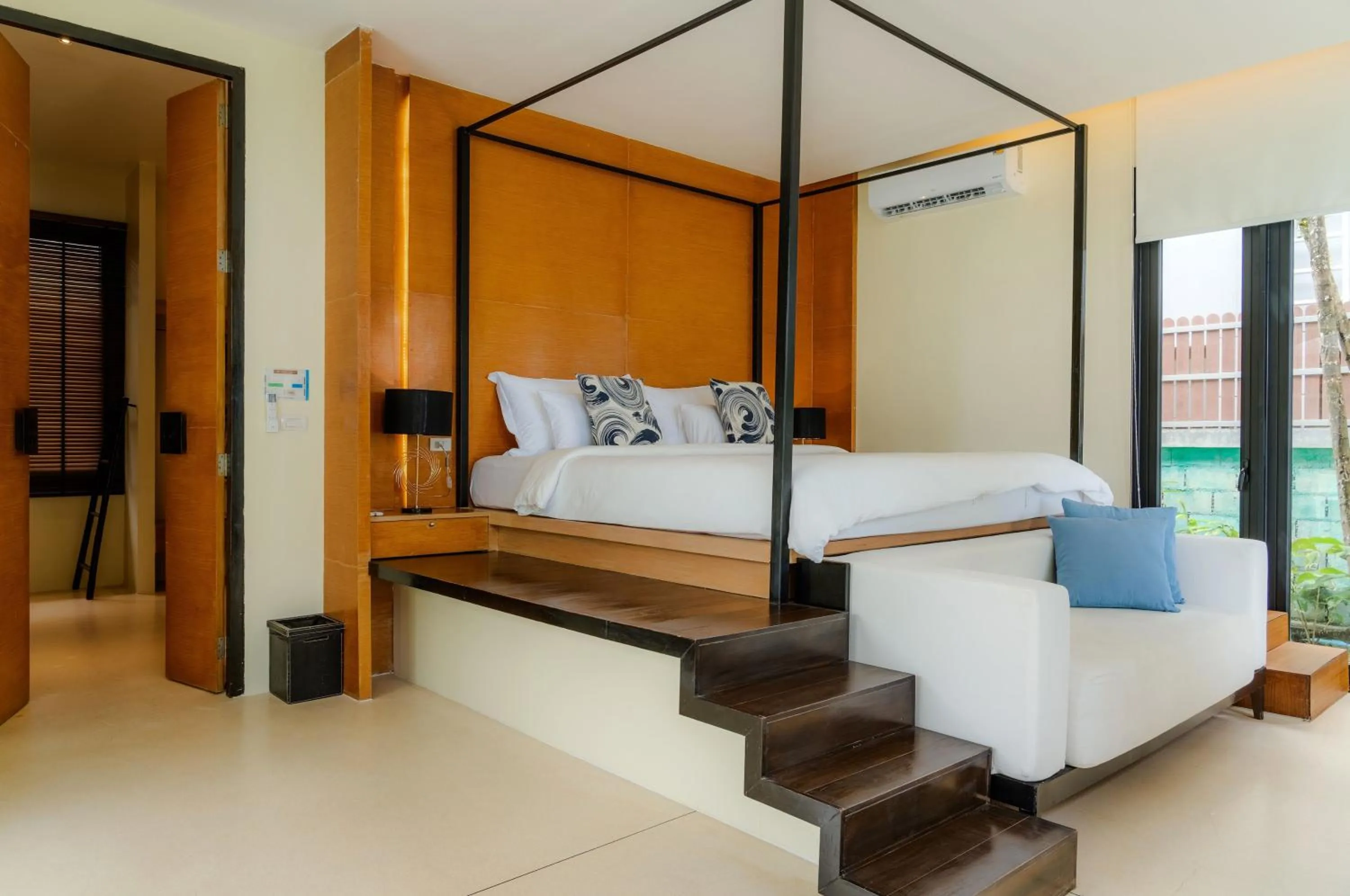 Bed in The Anda Mani Khaolak Beachfront Villas