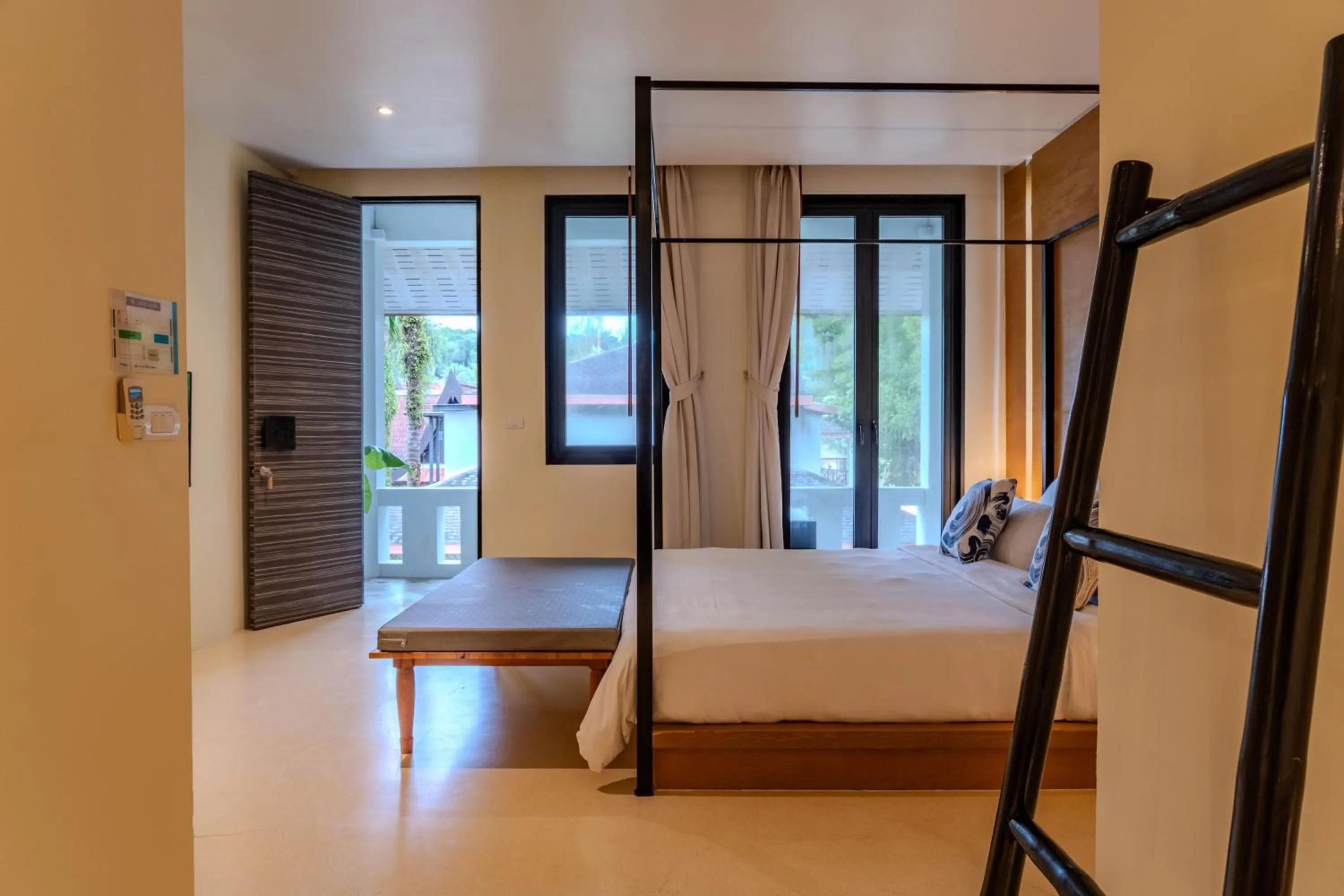 Bed in The Anda Mani Khaolak Beachfront Villas