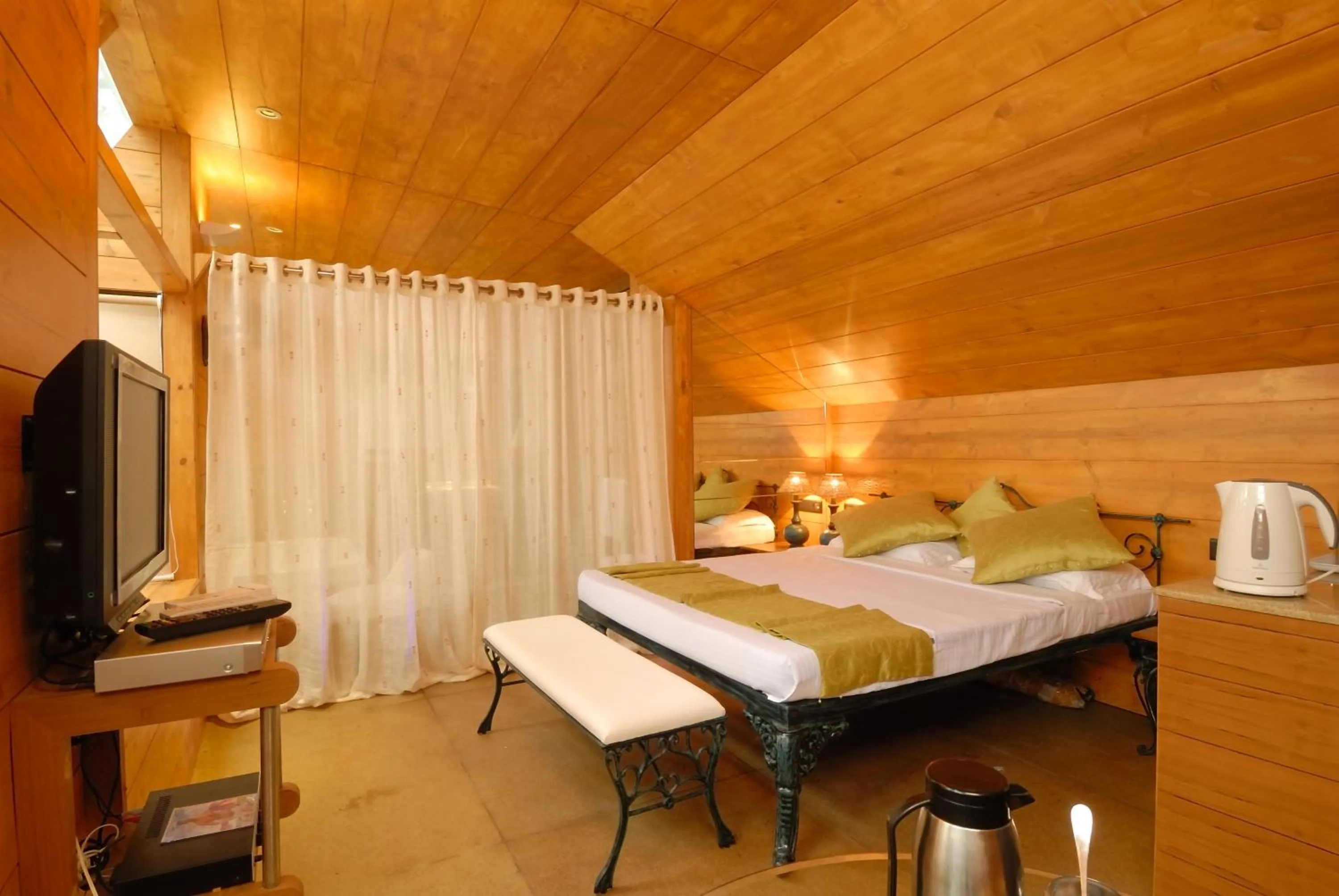 Bed in Ramsukh Resorts and Spa