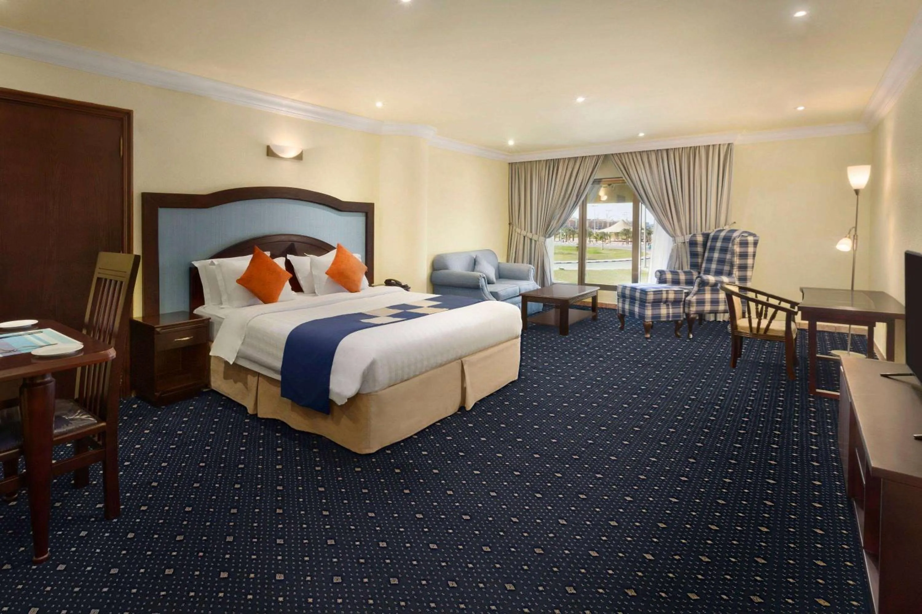 Photo of the whole room, Bed in Howard Johnson Dammam Hotel