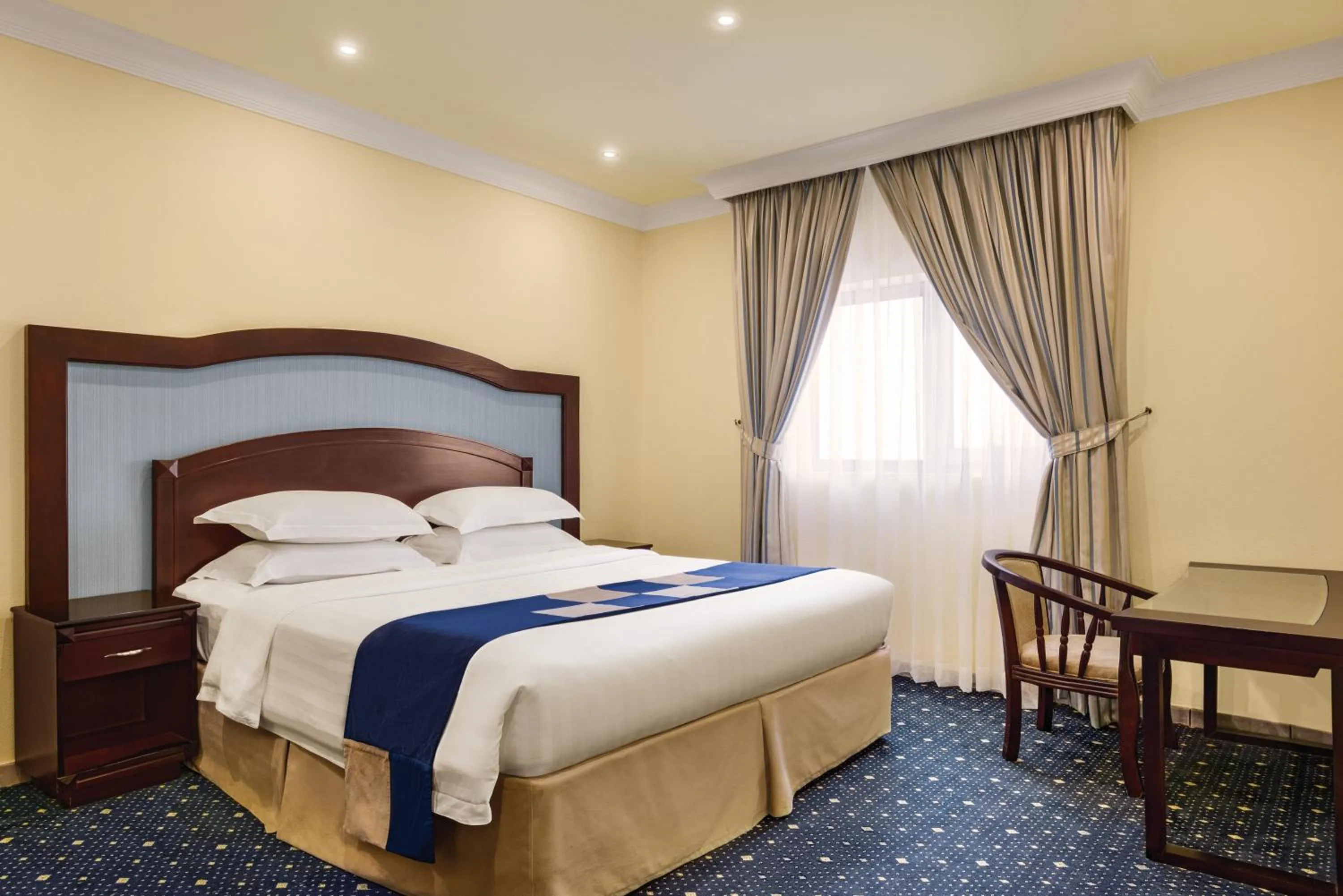 Bed in Howard Johnson Dammam Hotel