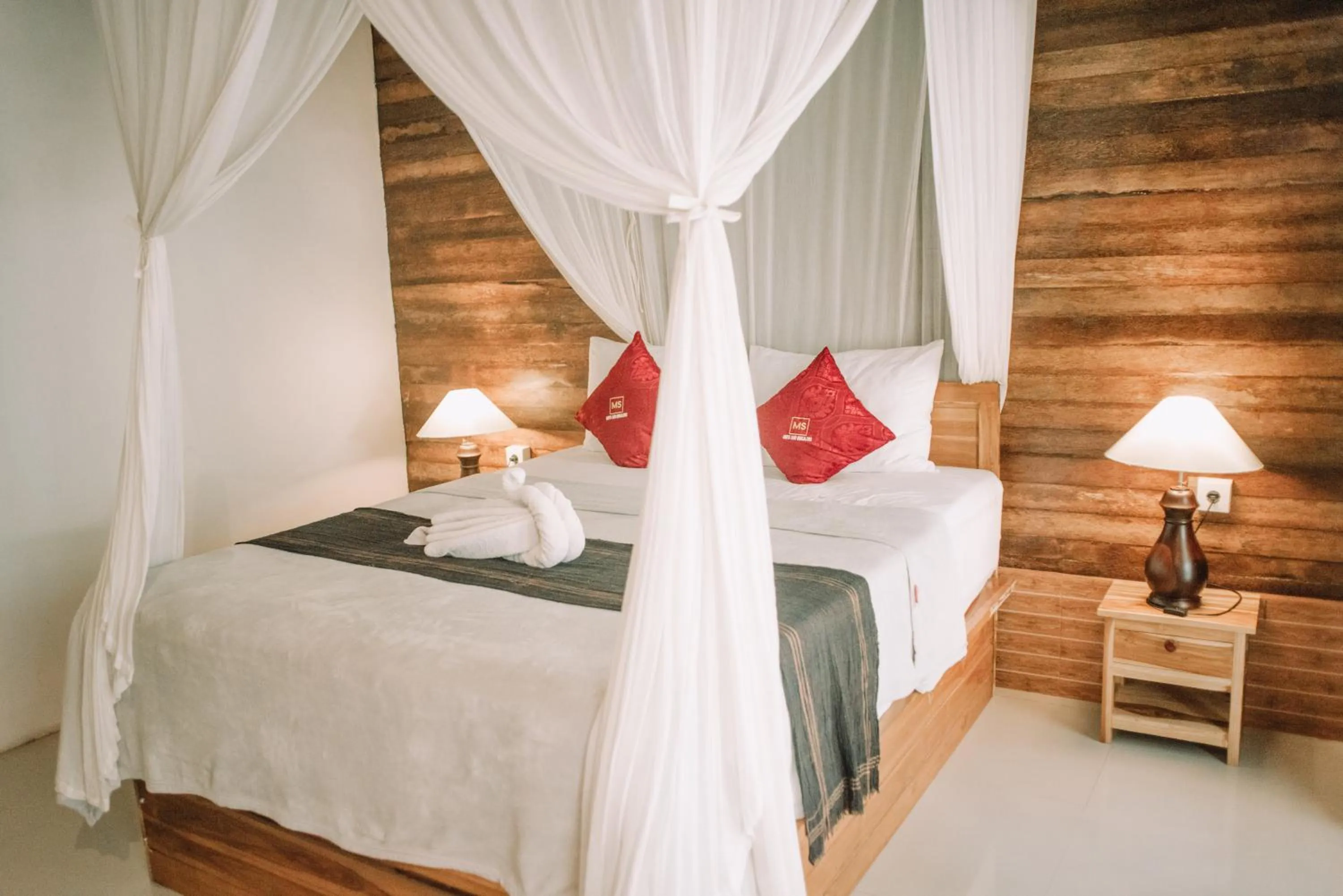 Bed in Mertasari Bungalows