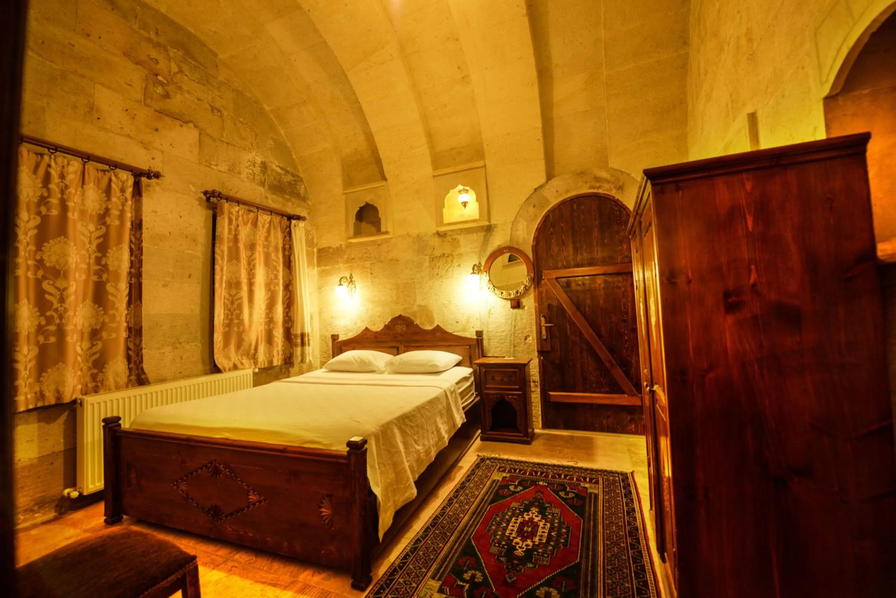 Bed in Vineyard Cave Hotel