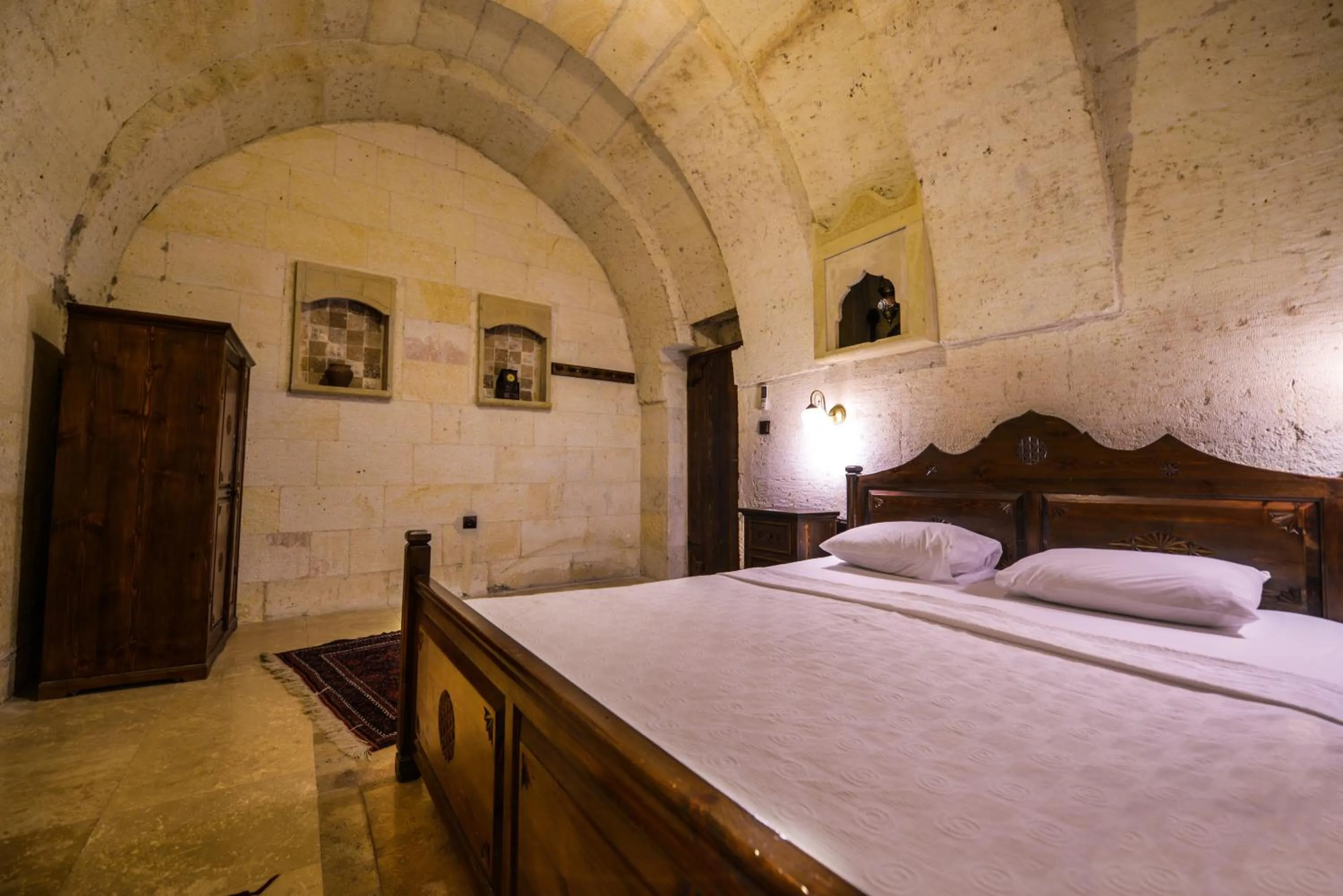 Bed in Vineyard Cave Hotel