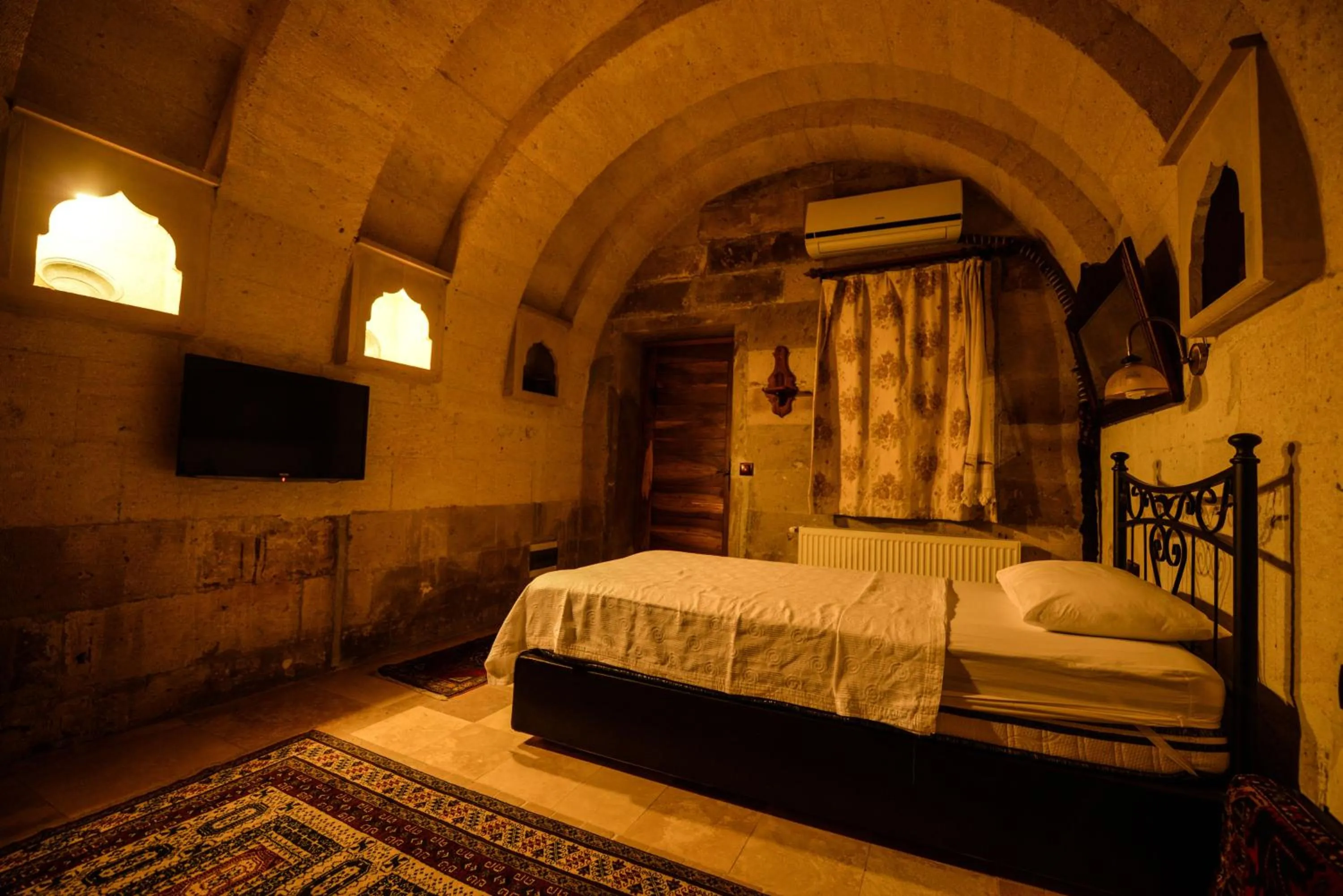 Bed in Vineyard Cave Hotel
