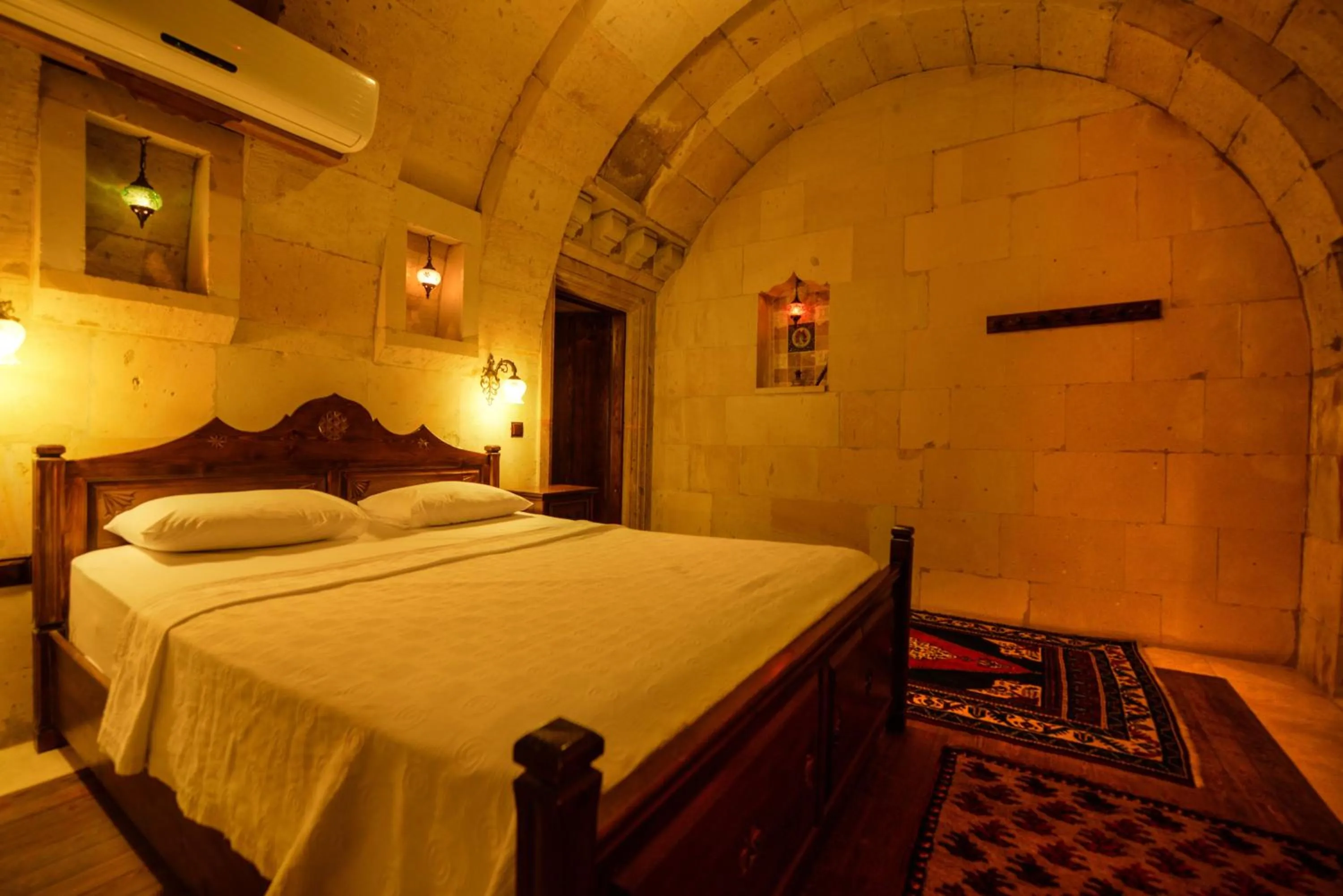 Bed in Vineyard Cave Hotel