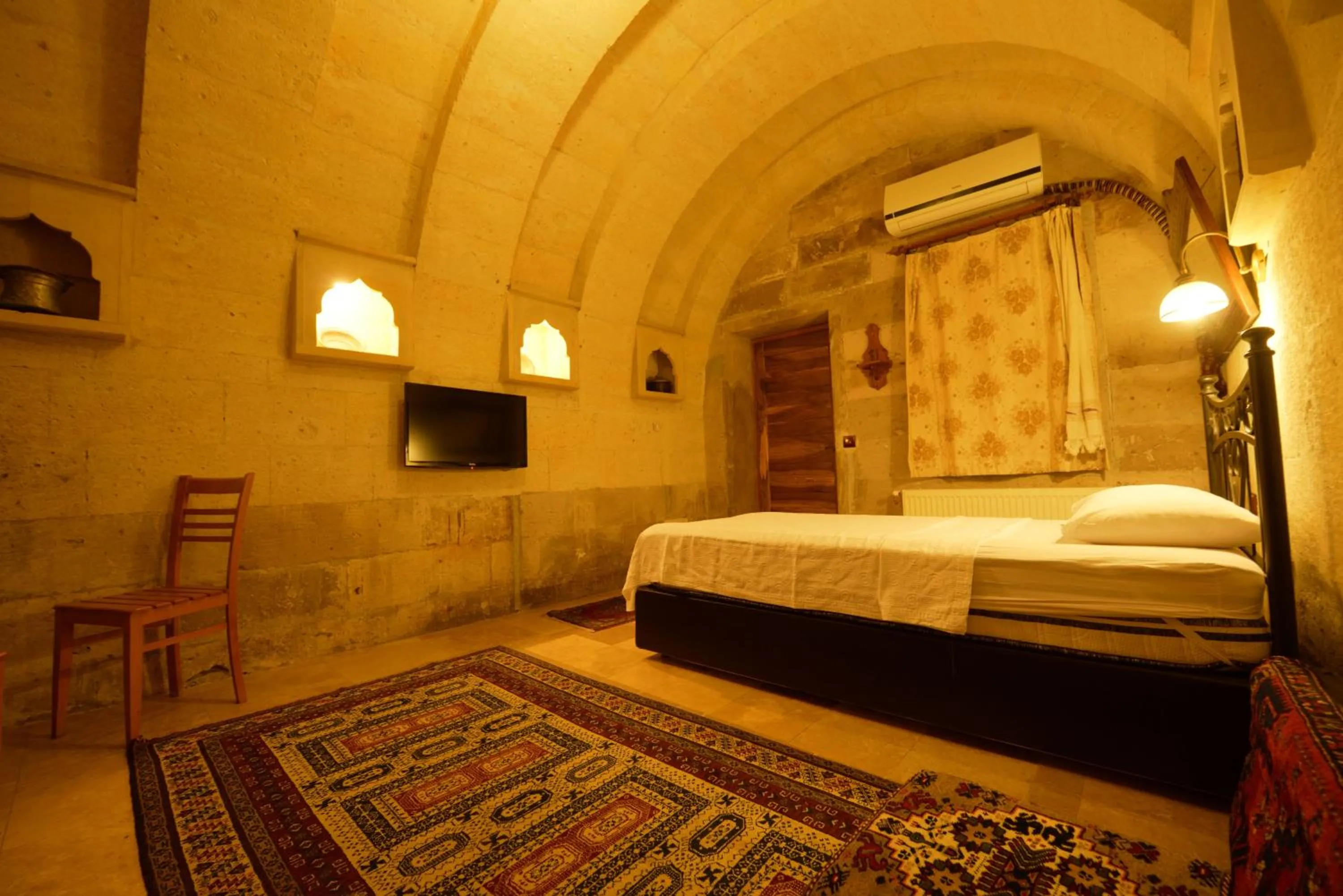 Bed in Vineyard Cave Hotel