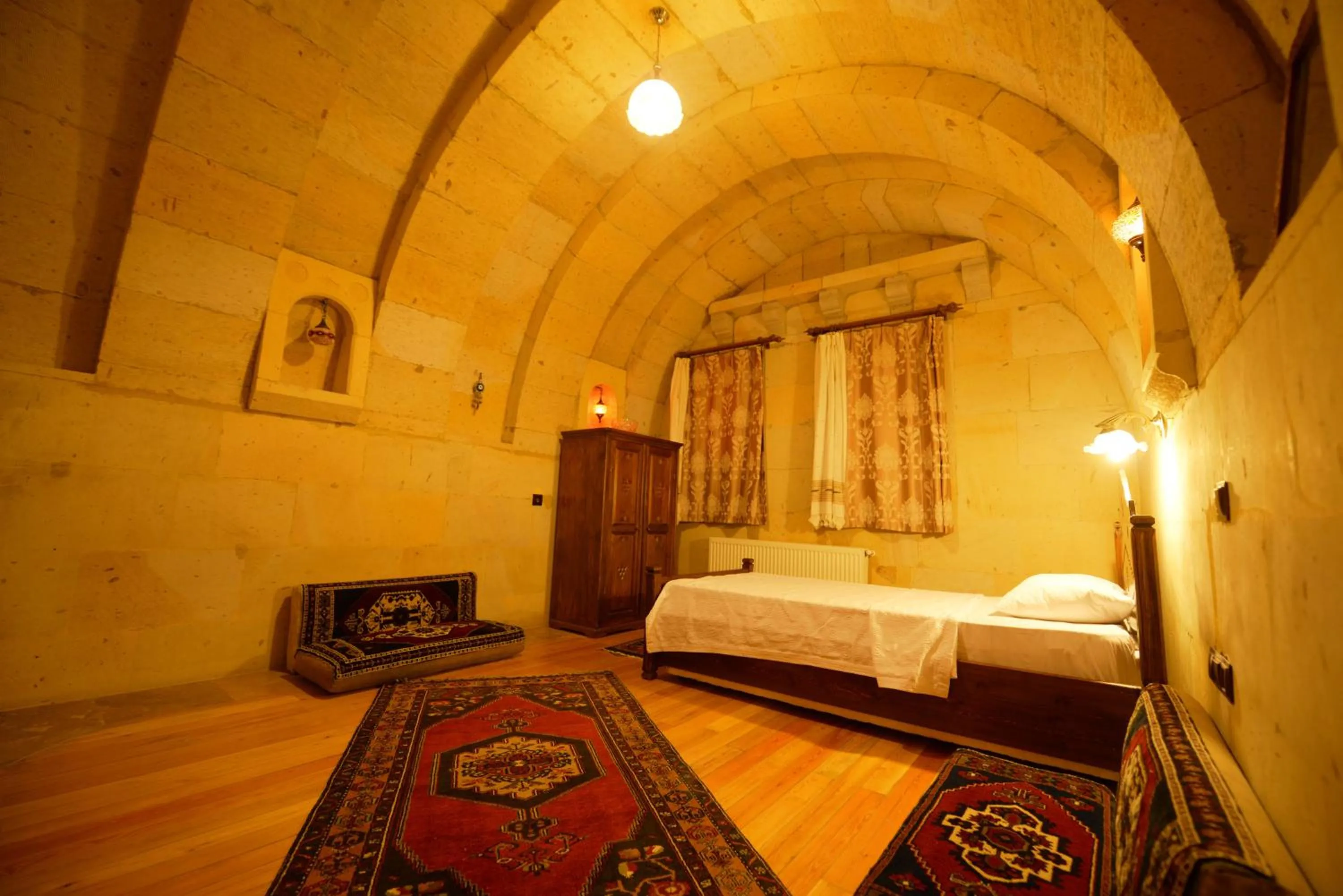 Bed in Vineyard Cave Hotel