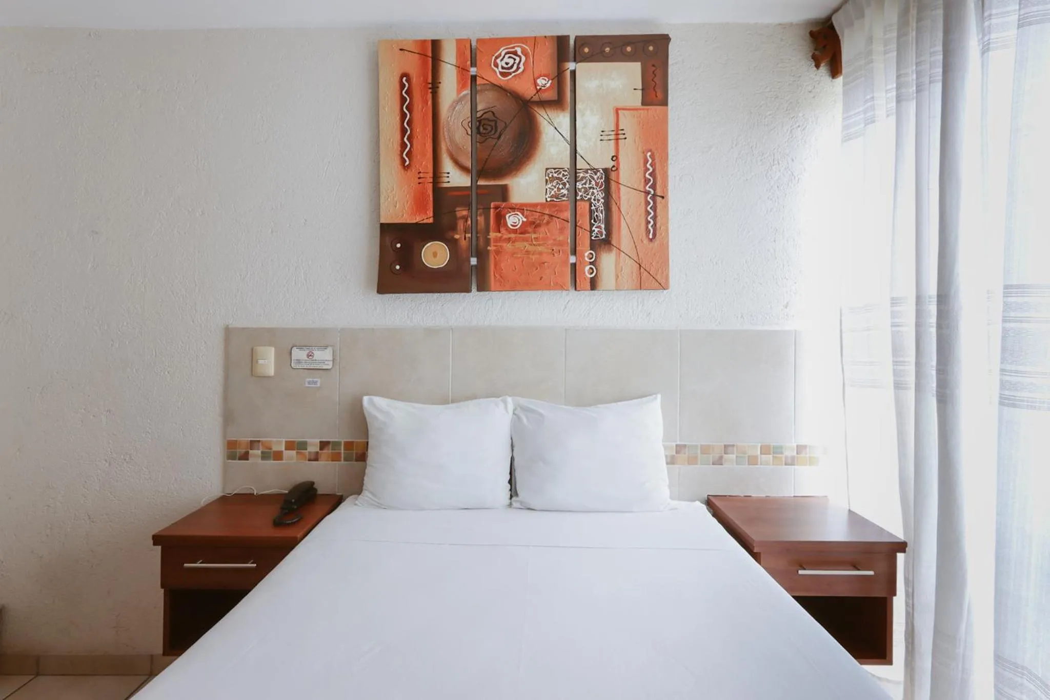 Bed in Hotel Guivá Huatulco