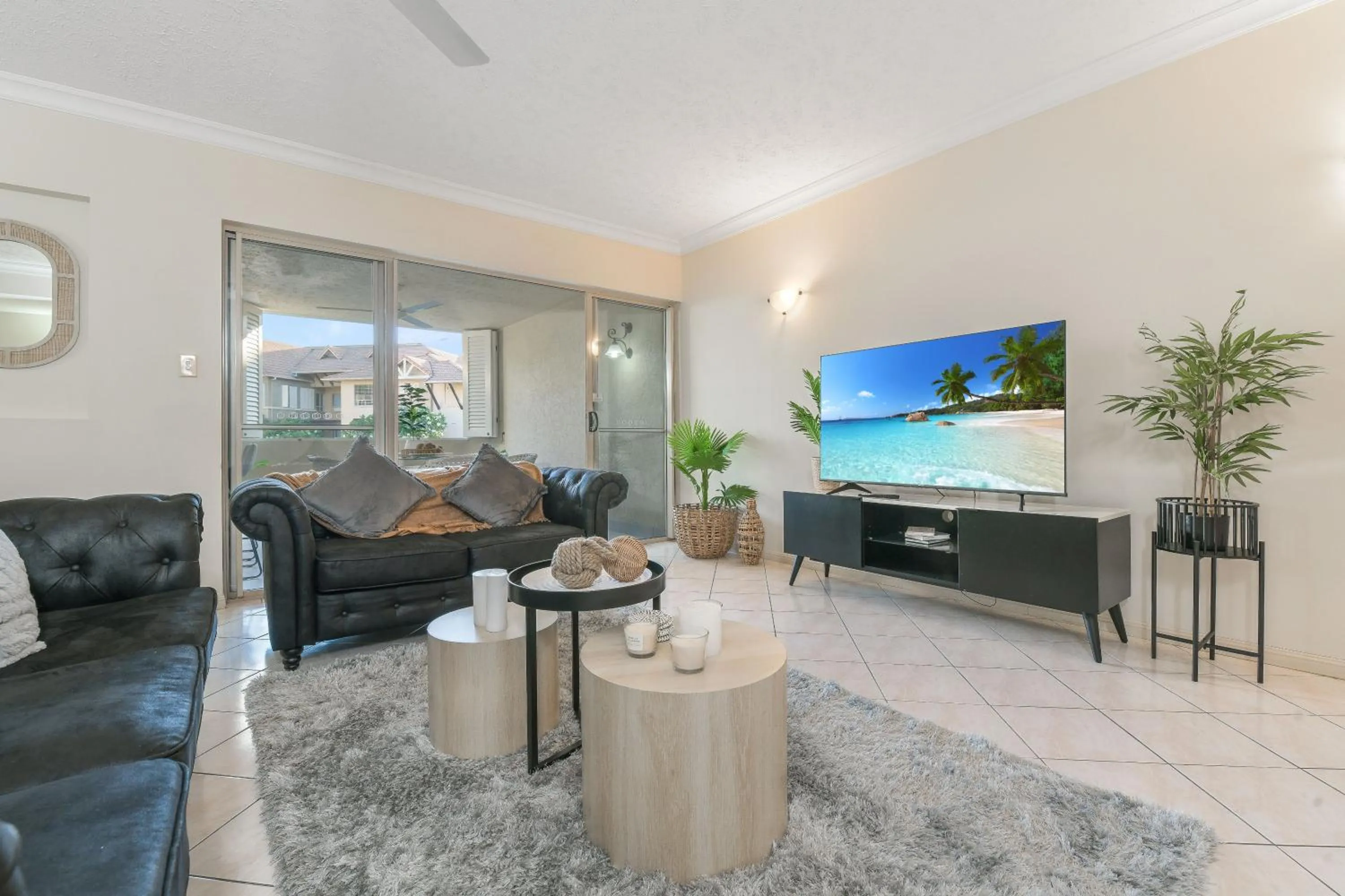 Communal lounge/ TV room in The Lakes Resort Cairns