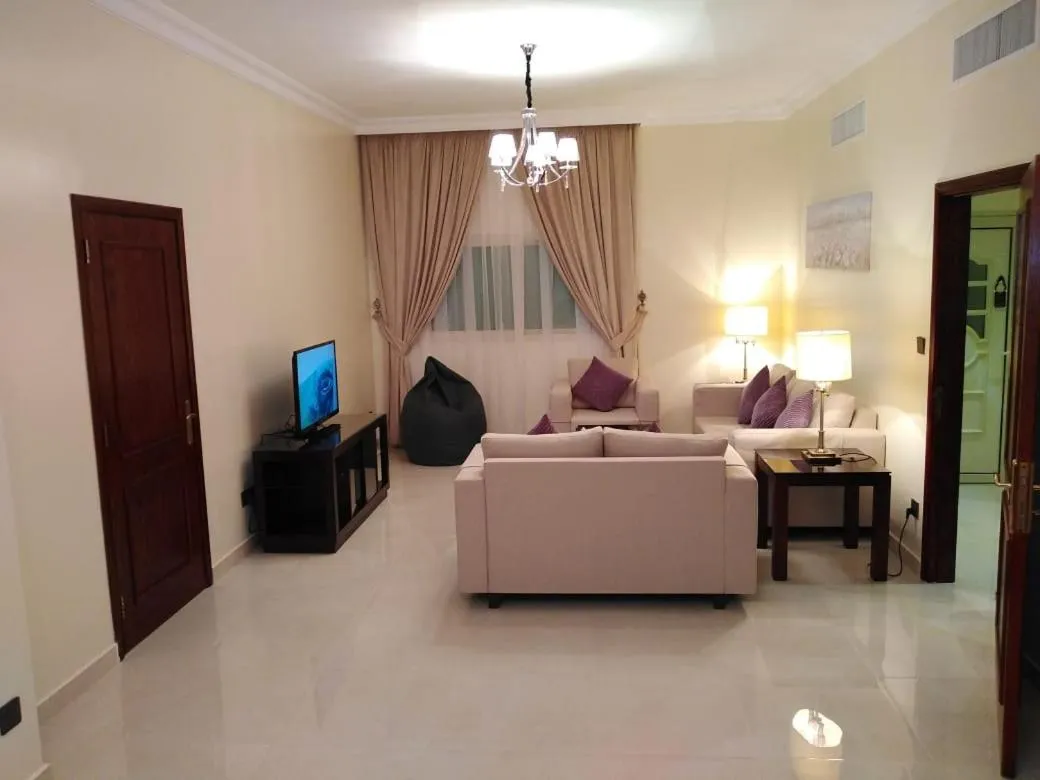 Communal lounge/ TV room in Al Gosaibi Hotel - Villa