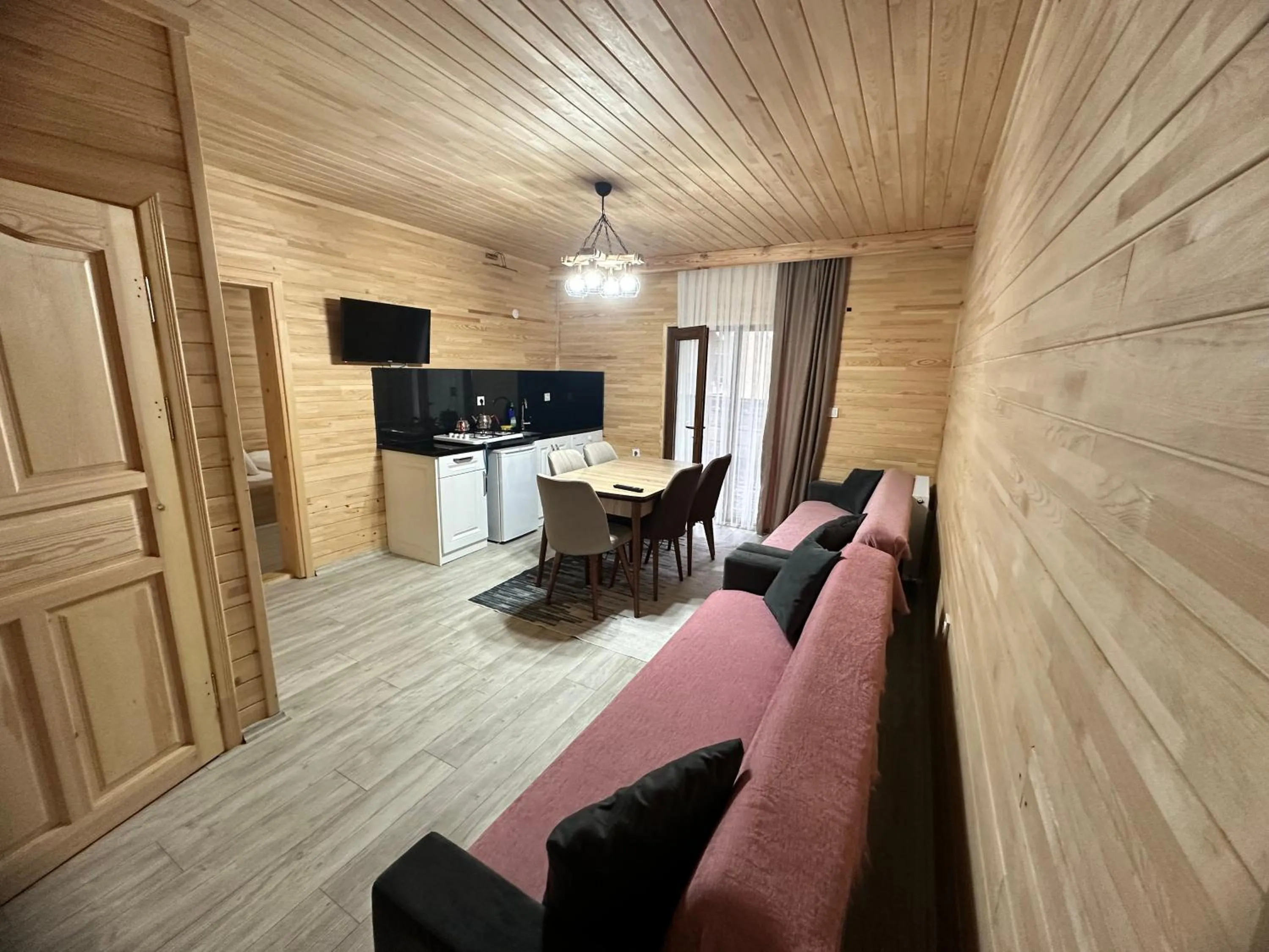 Communal lounge/ TV room in Haros Suite Hotel