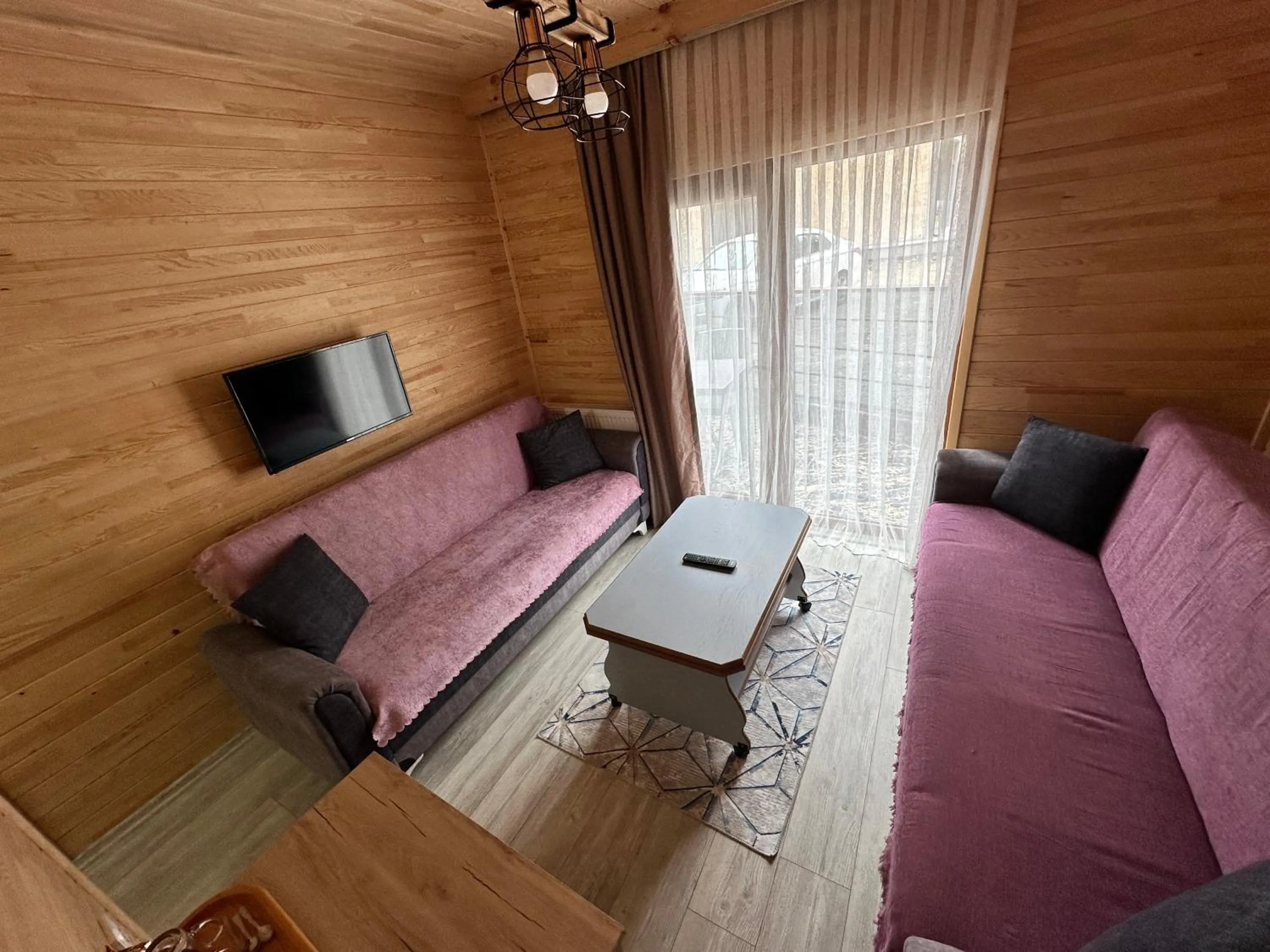 Communal lounge/ TV room in Haros Suite Hotel