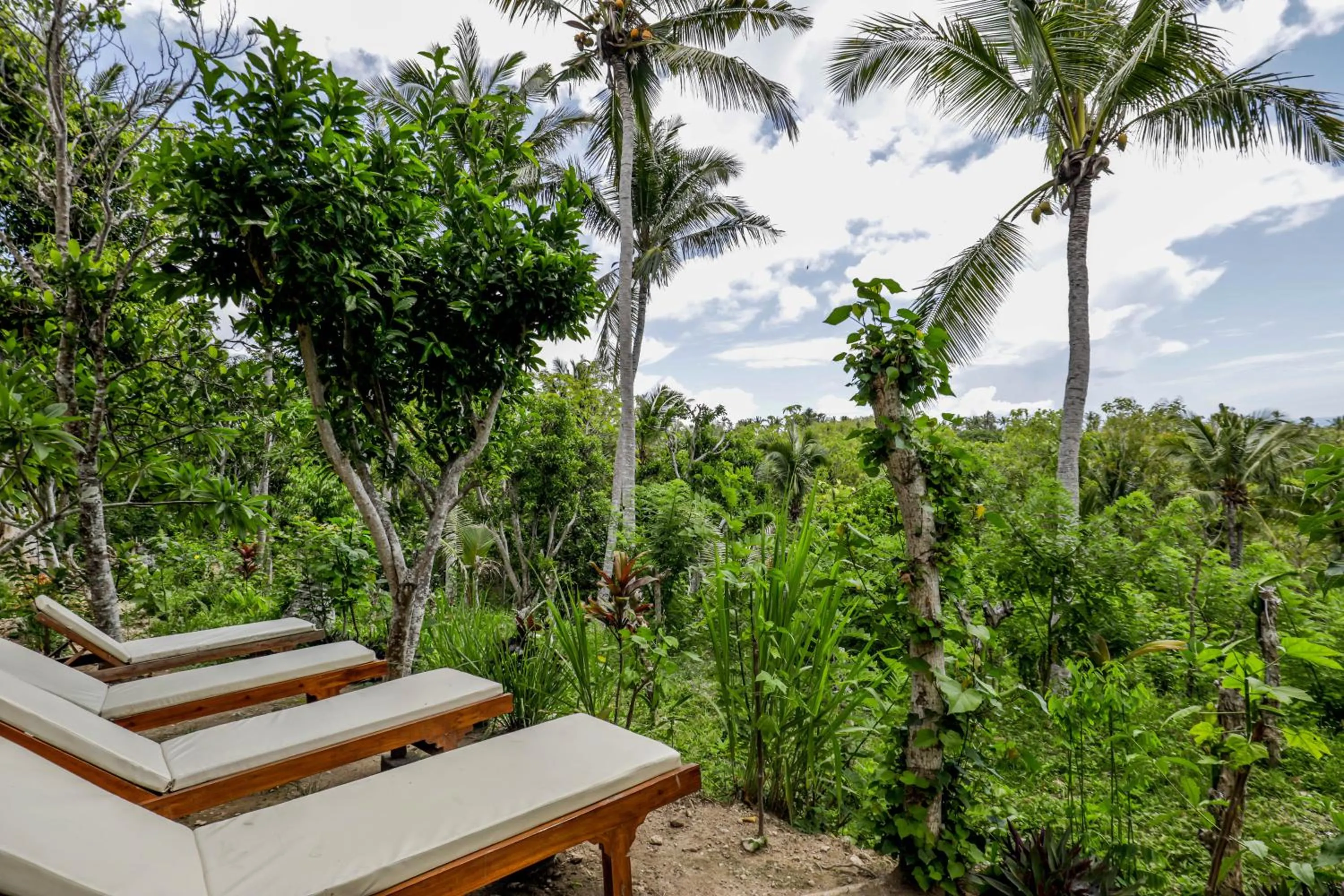 Seating area in Atuh Forest Cottage