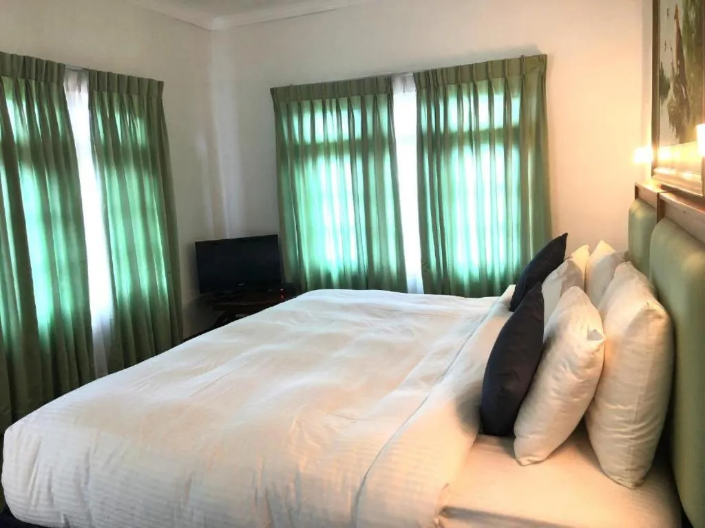 Bed in Tea Bush Hotel
