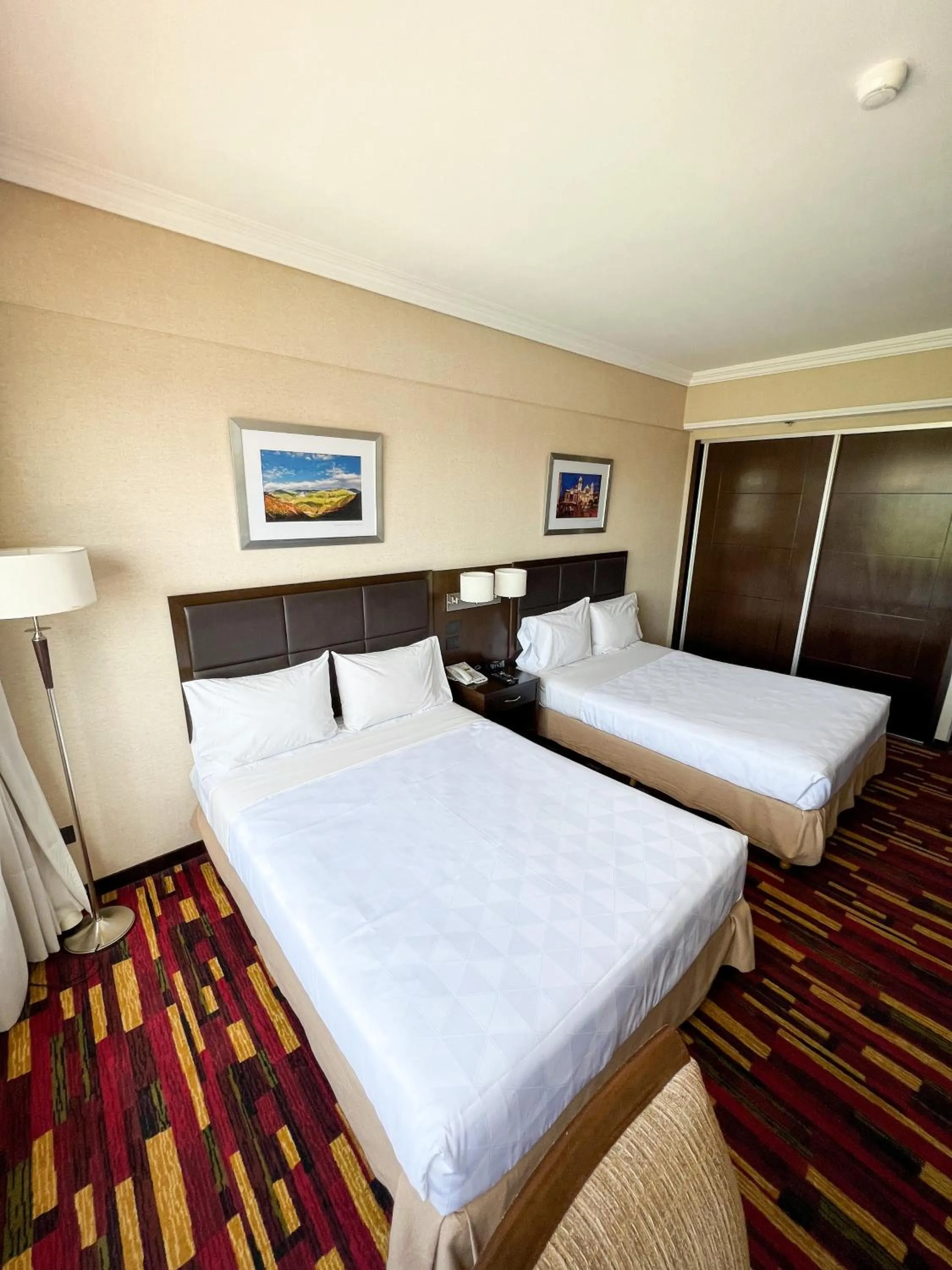 Bed in Holiday Inn Ezeiza Airport, an IHG Hotel