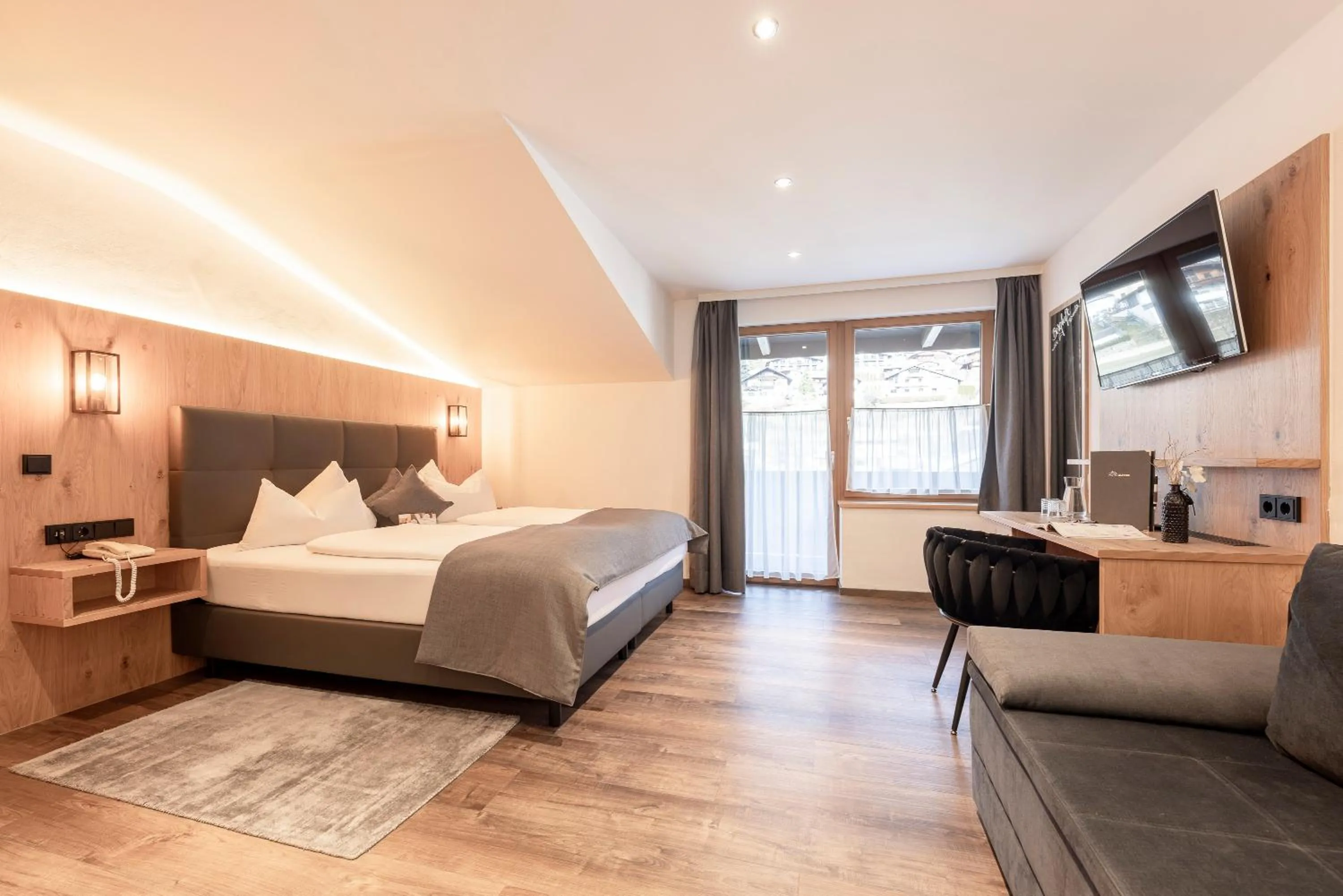 Photo of the whole room, Bed in Hotel Alphof Stubaital