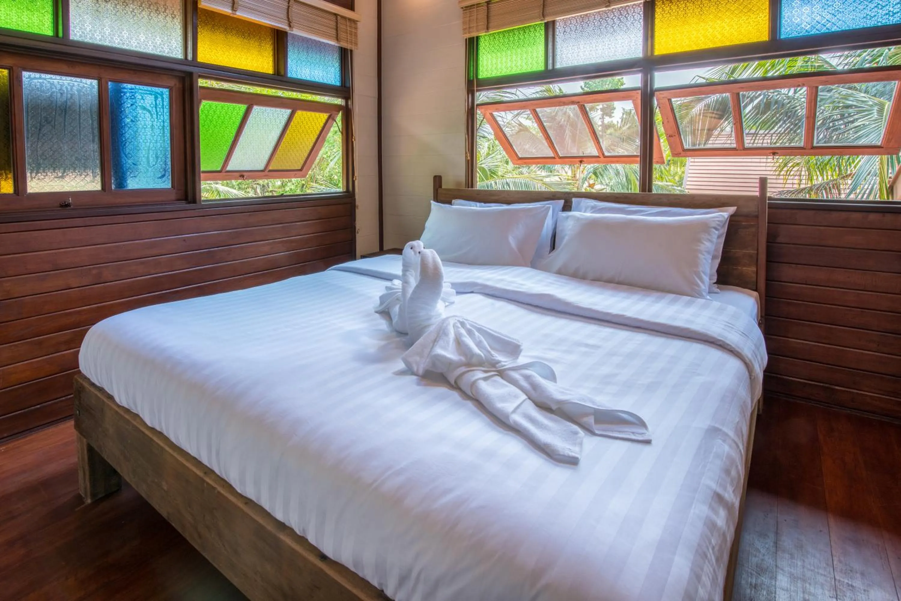 Bed in Suankaew Art Cottage