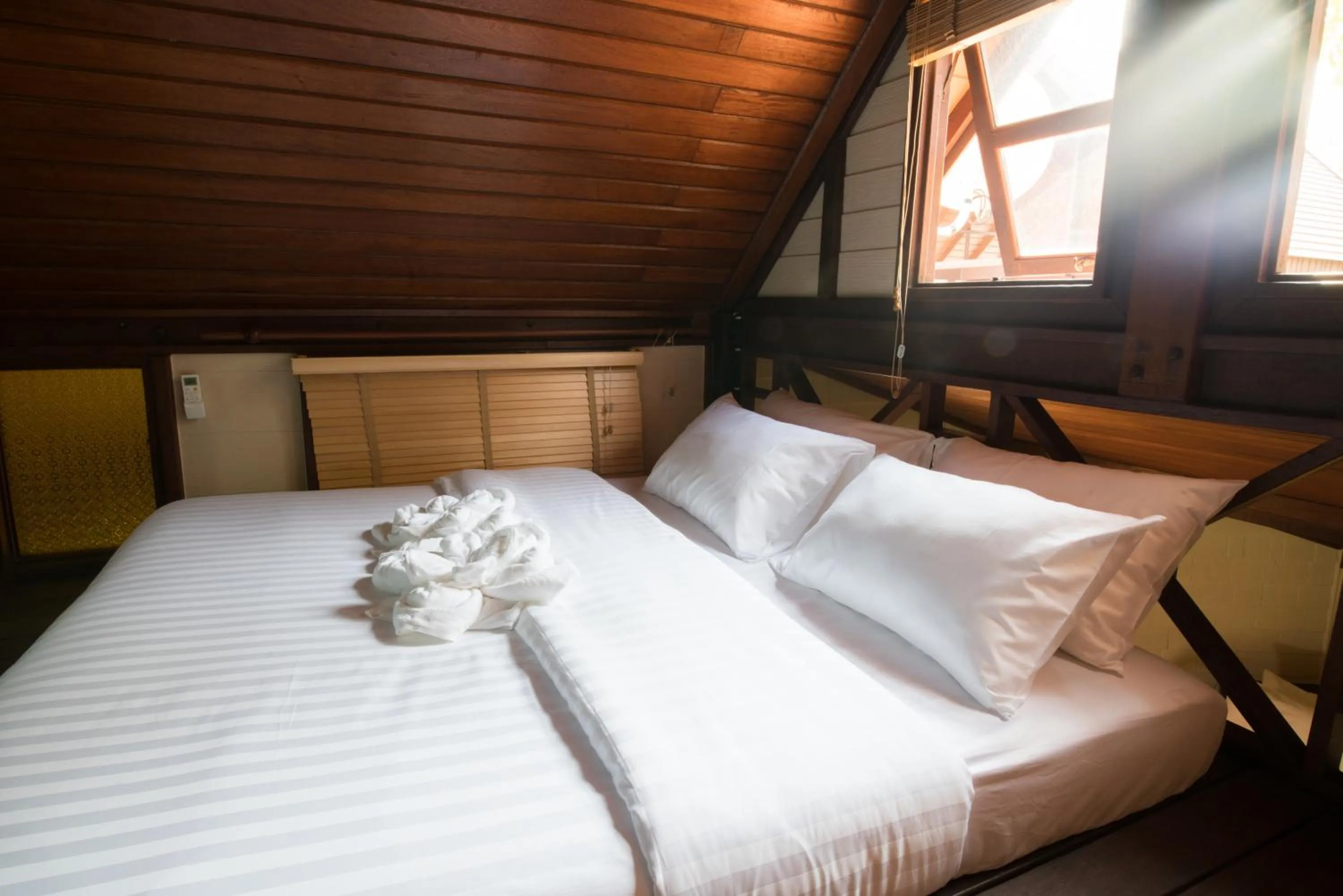 Bed in Suankaew Art Cottage