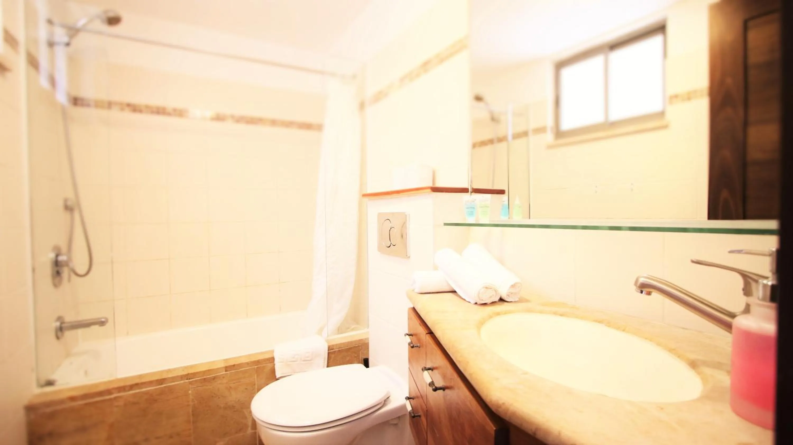 Bathroom in The Market Courtyard - Suites Hotel