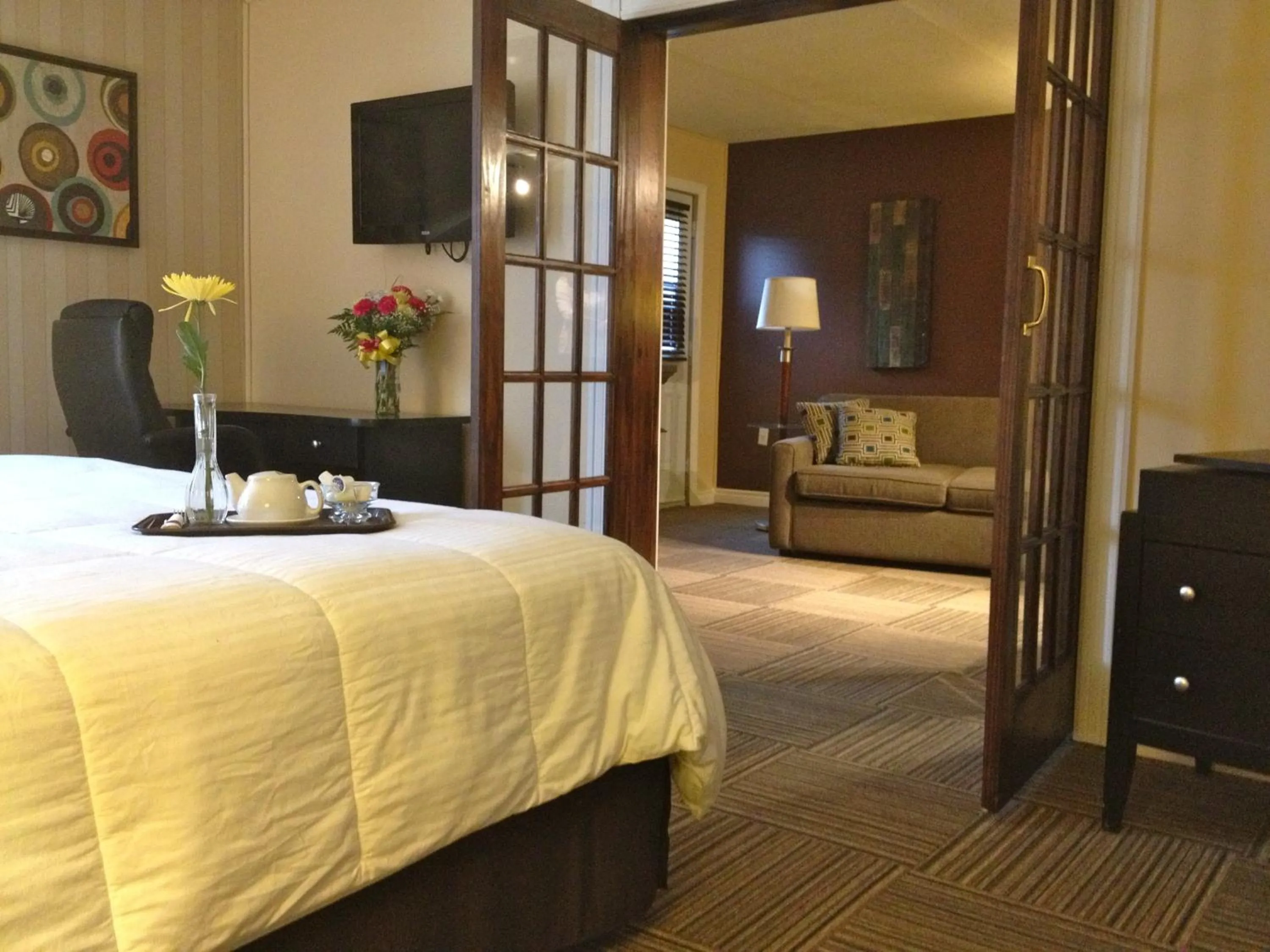 Living room, Bed in Travelodge by Wyndham Miramichi New Brunswick