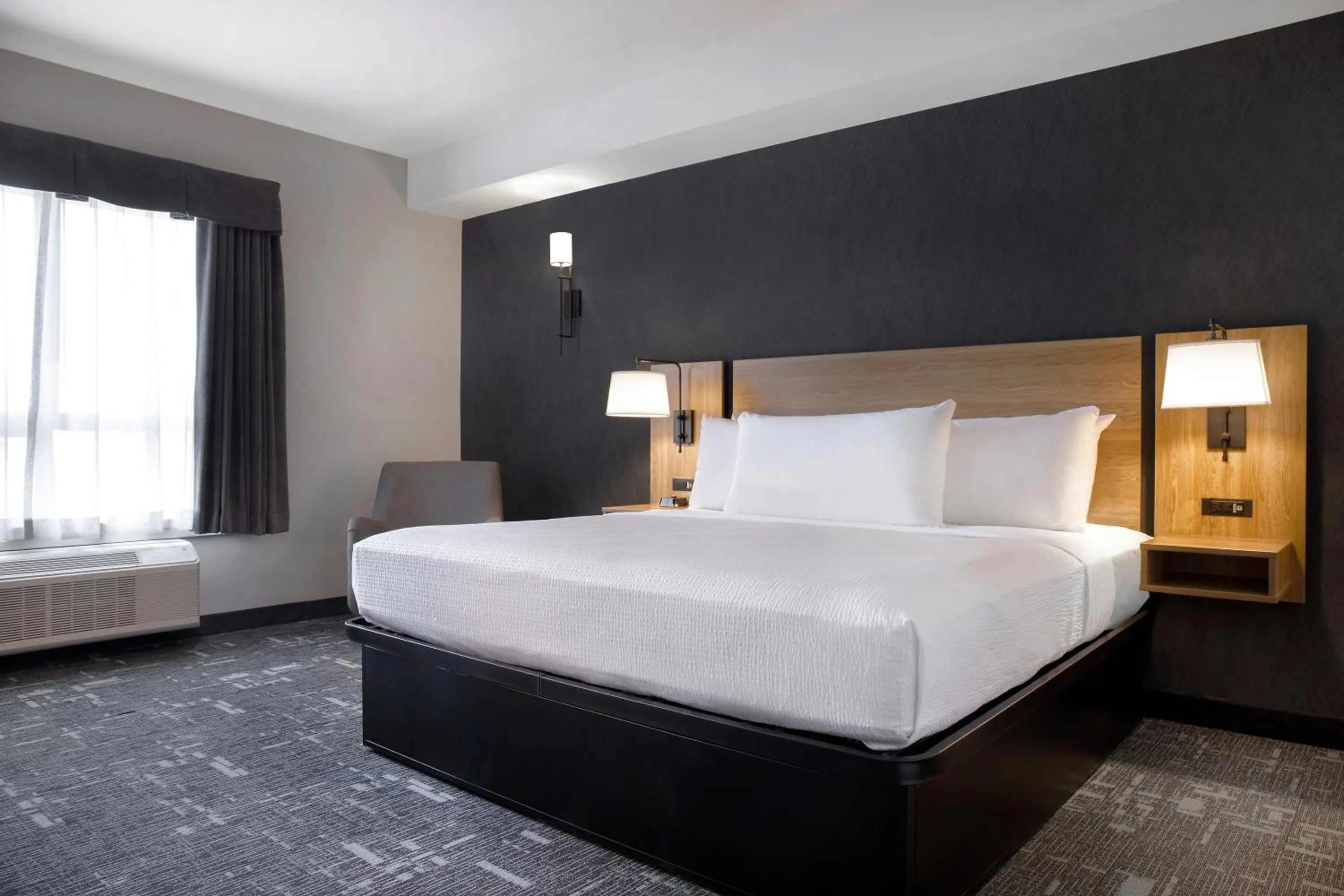 Bedroom in Ramada by Wyndham Cochrane