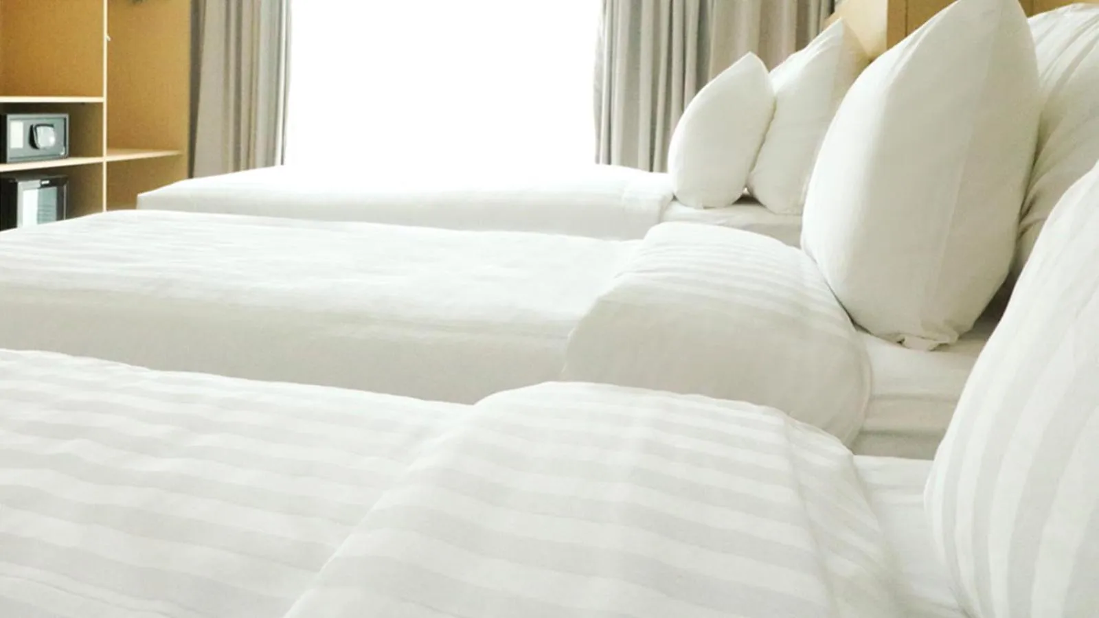 Bed in PALM PARK Hotel Surabaya