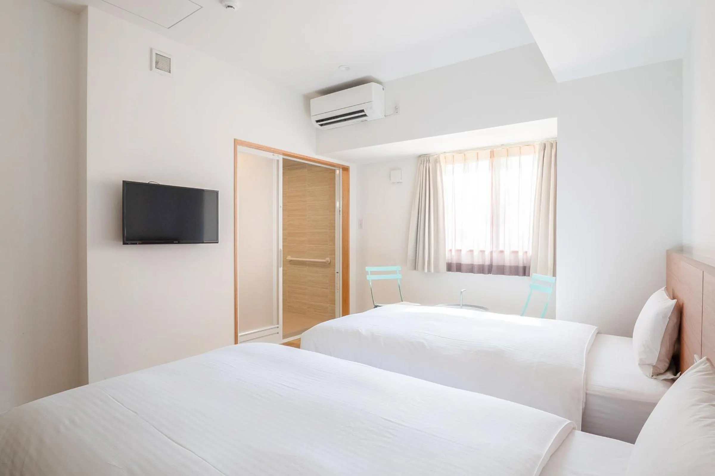 Photo of the whole room, Bed in Smile Hotel Miyakojima