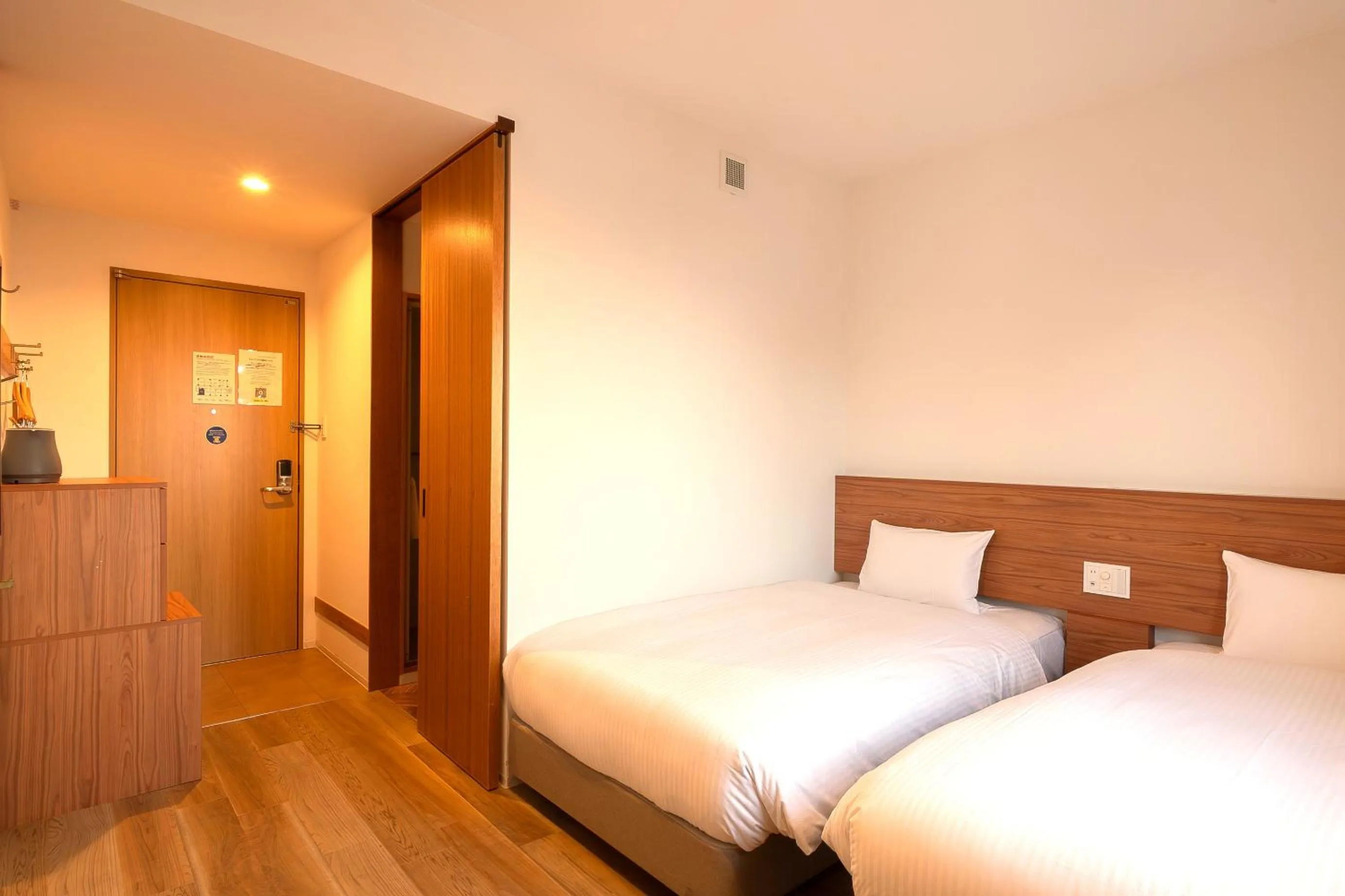 Bed in Smile Hotel Miyakojima