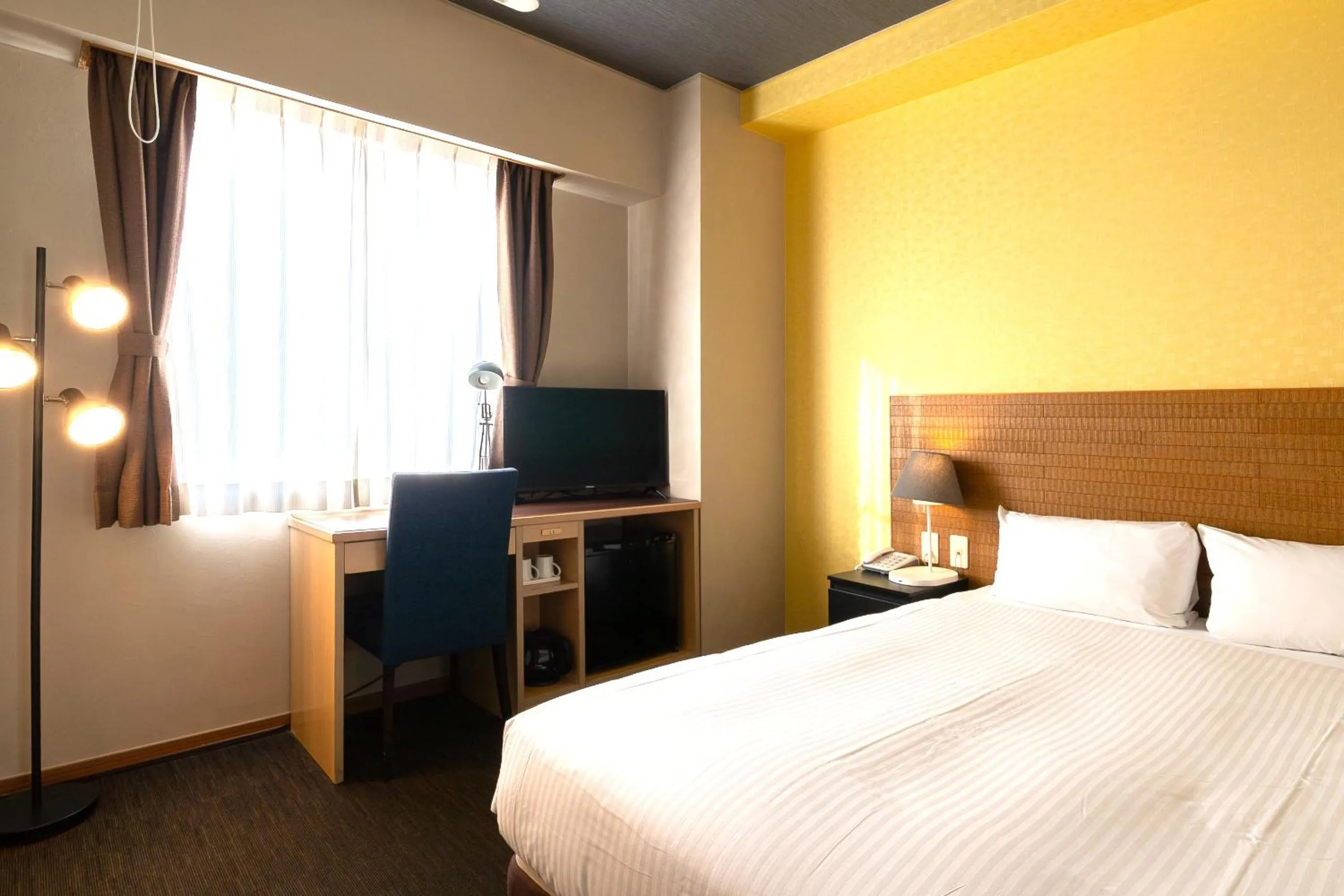 Bed in Smile Hotel Miyakojima