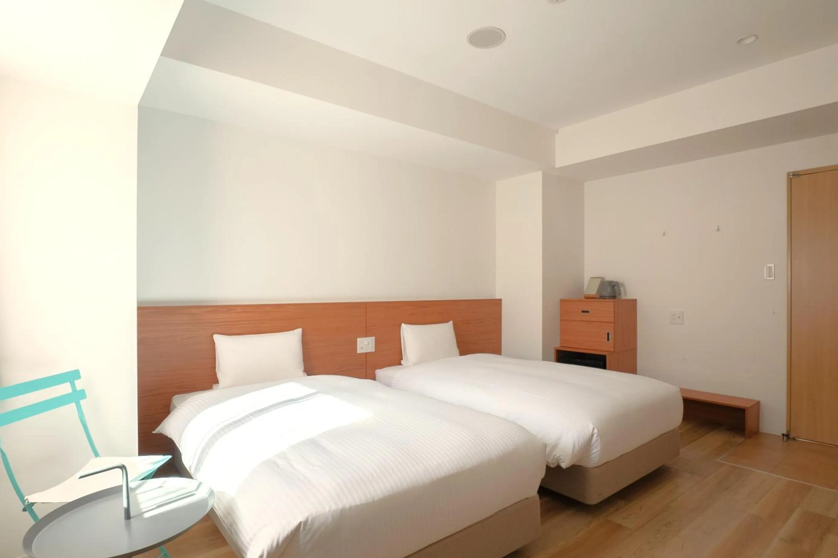 Bed in Smile Hotel Miyakojima