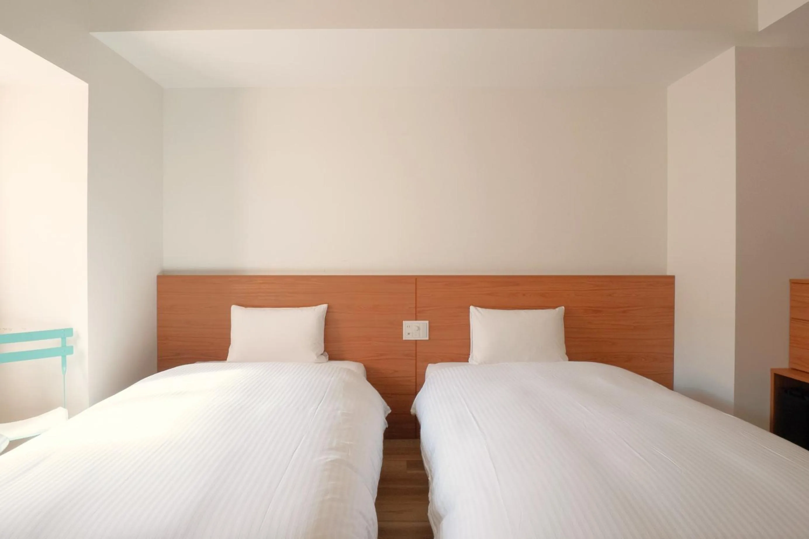 Bed in Smile Hotel Miyakojima