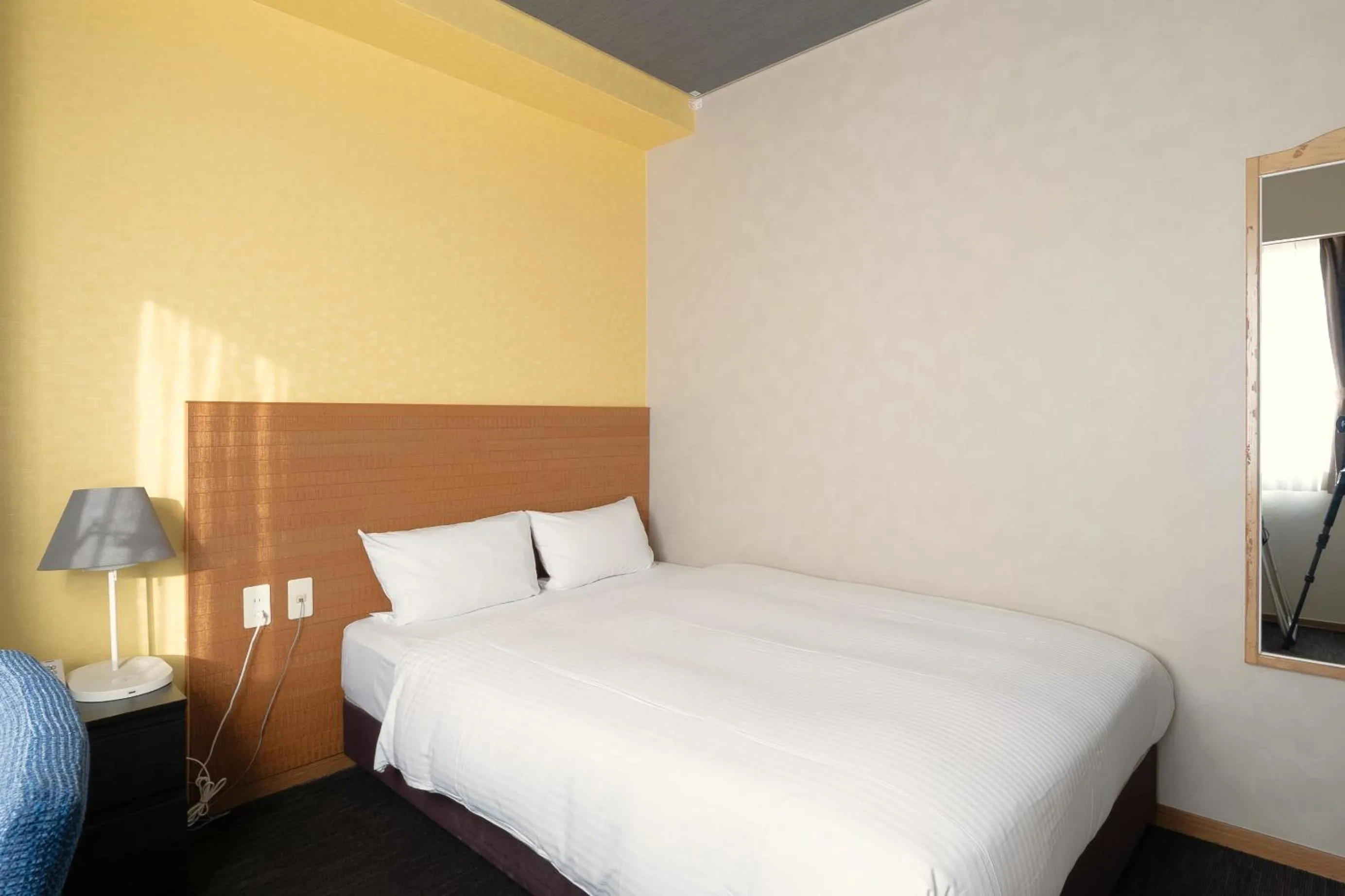 Bed in Smile Hotel Miyakojima