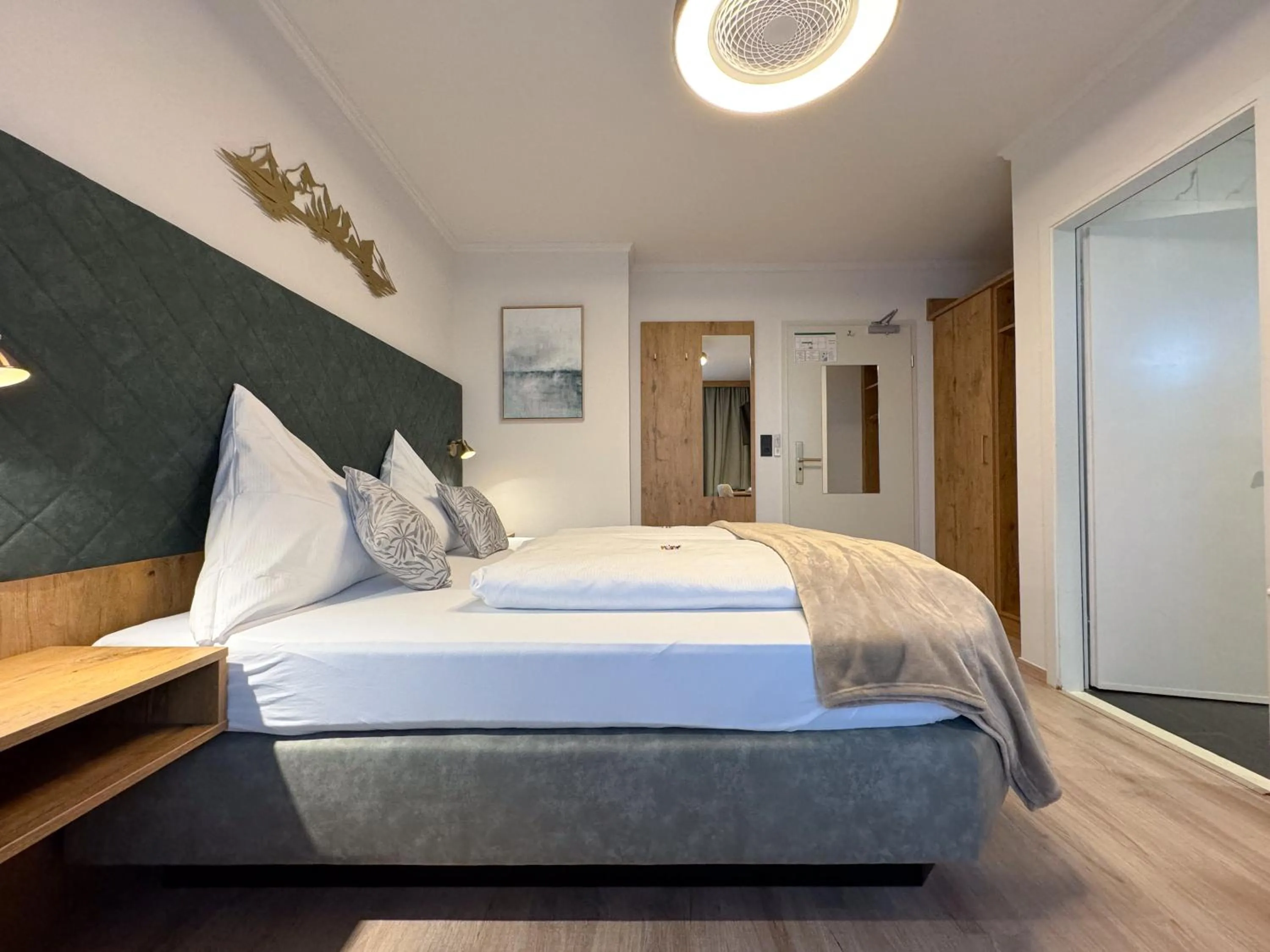 Photo of the whole room, Bed in Hotel Schlossblick Chiemsee