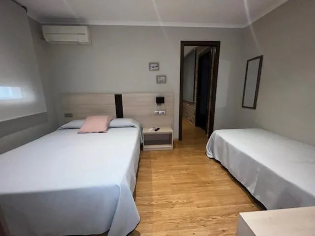 Bed in Hostal Crisami