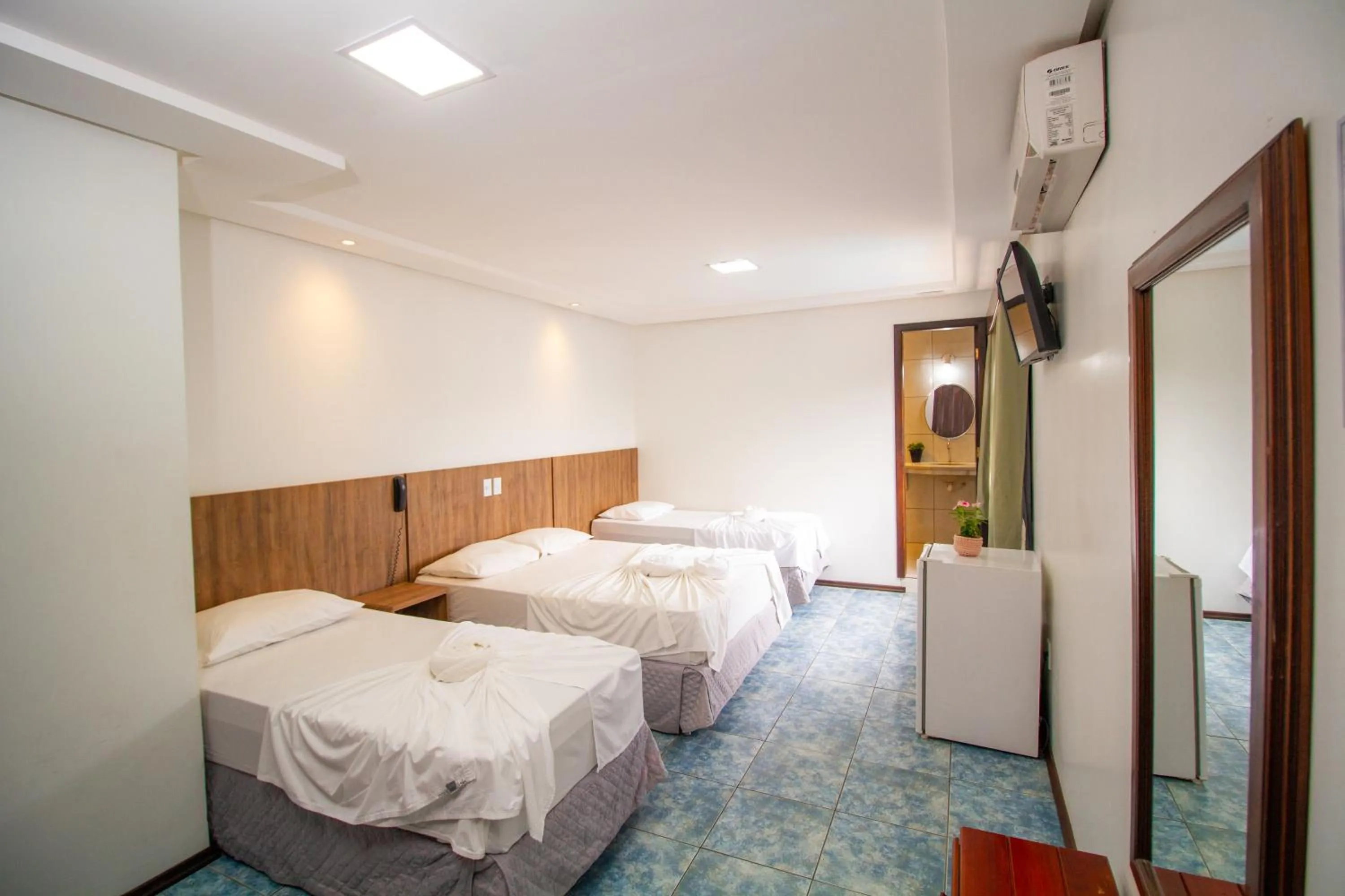 Bed in Hotel Bem Brasil