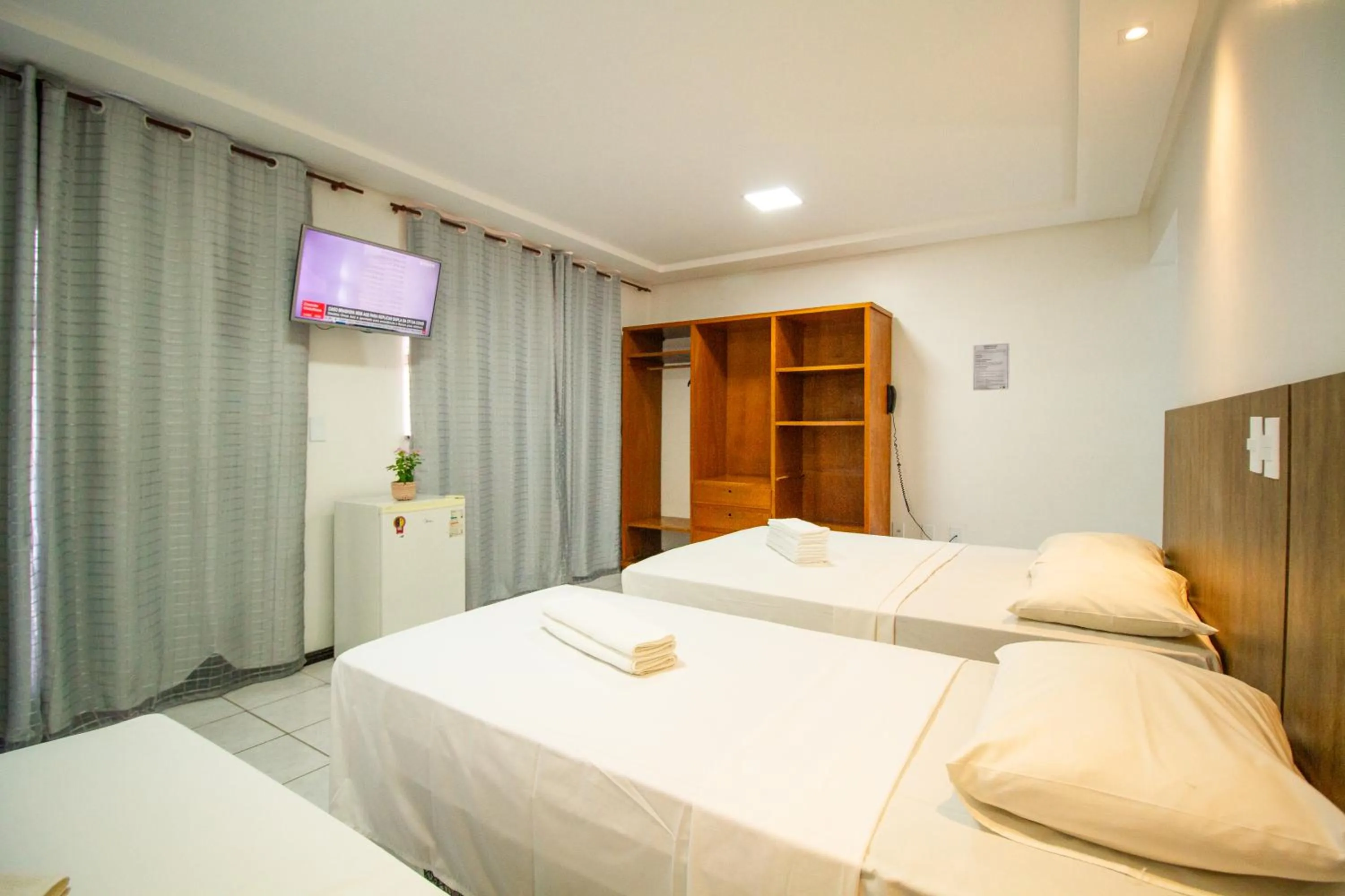 Bed in Hotel Bem Brasil