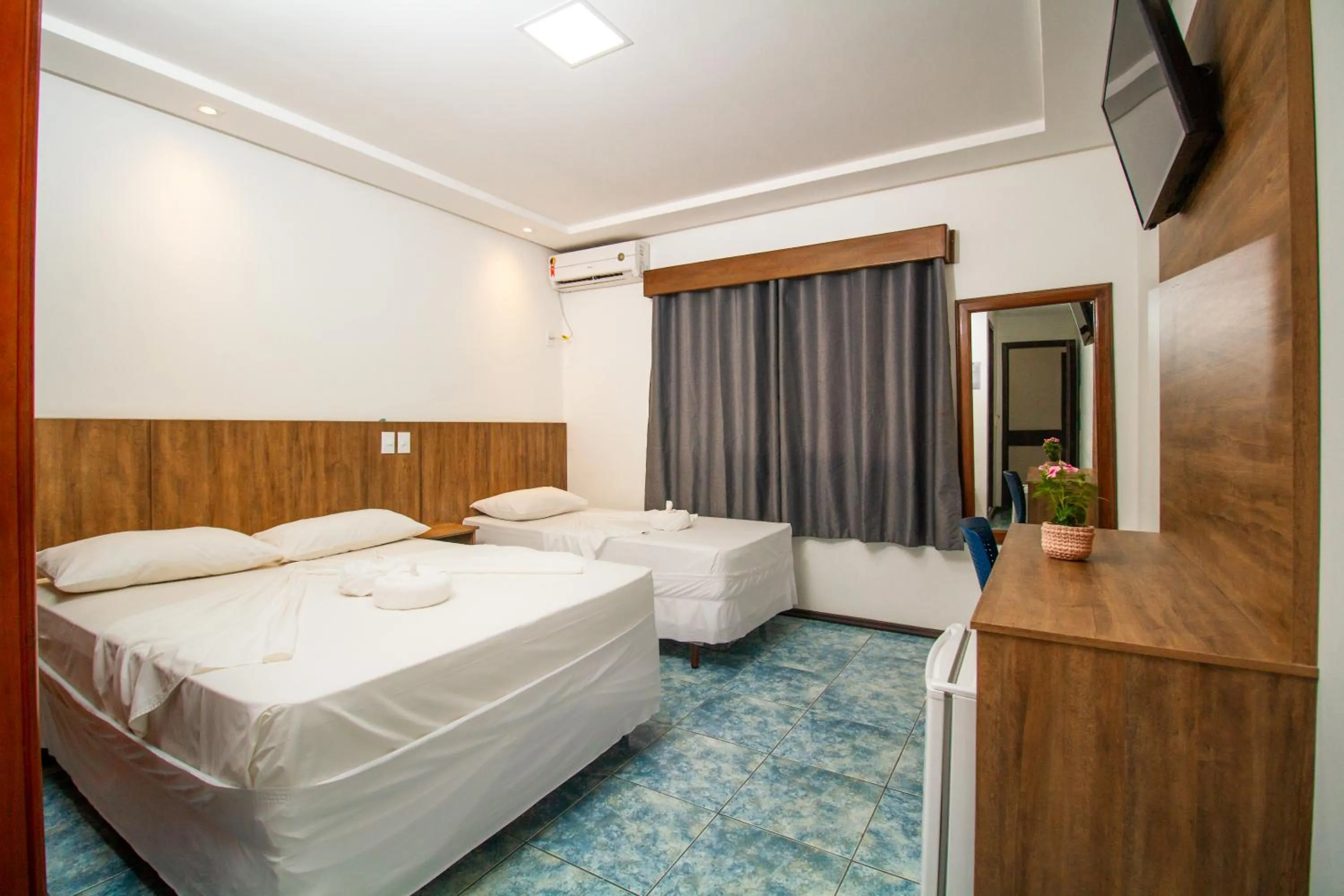 Bed in Hotel Bem Brasil