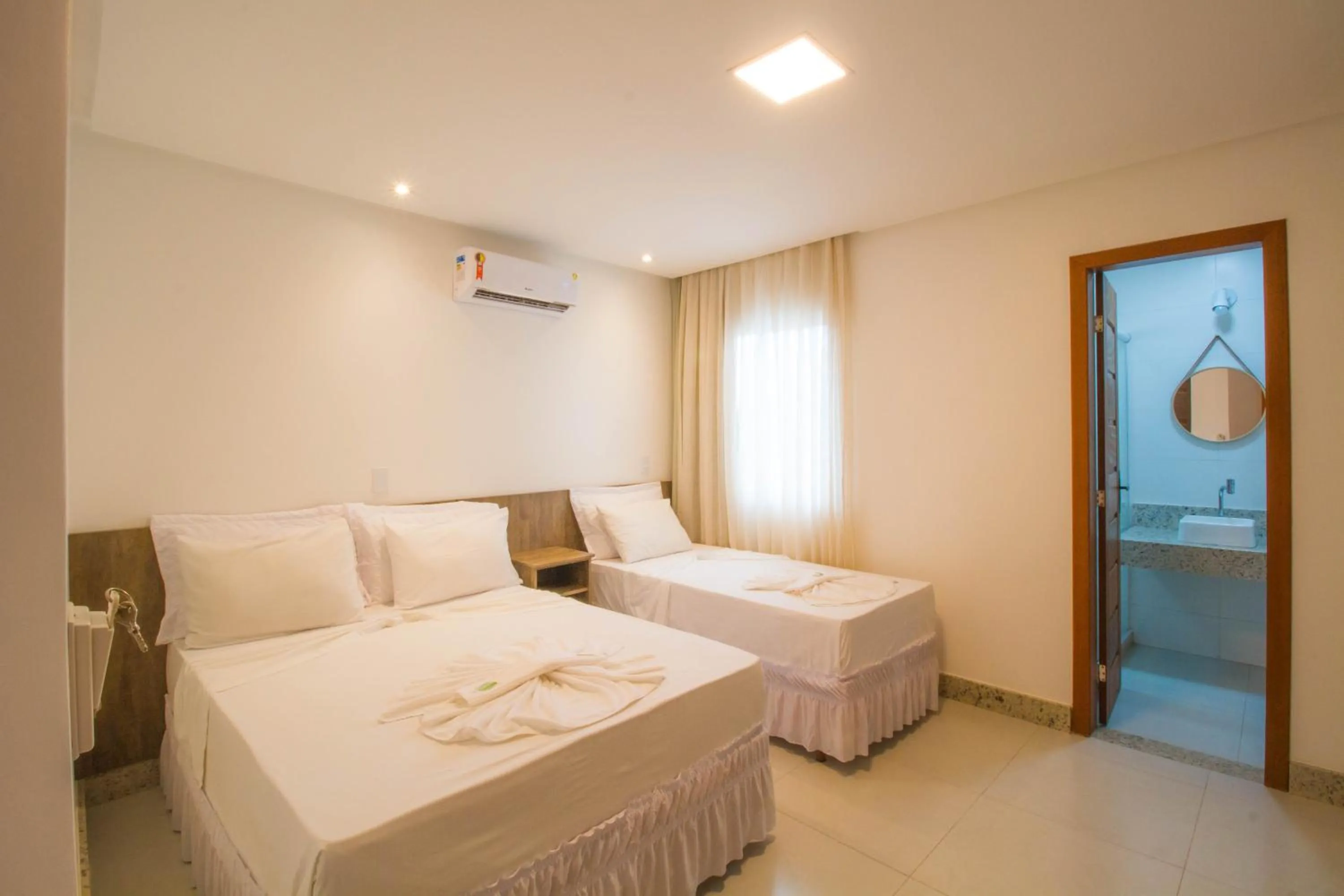 Bed in Hotel Bem Brasil