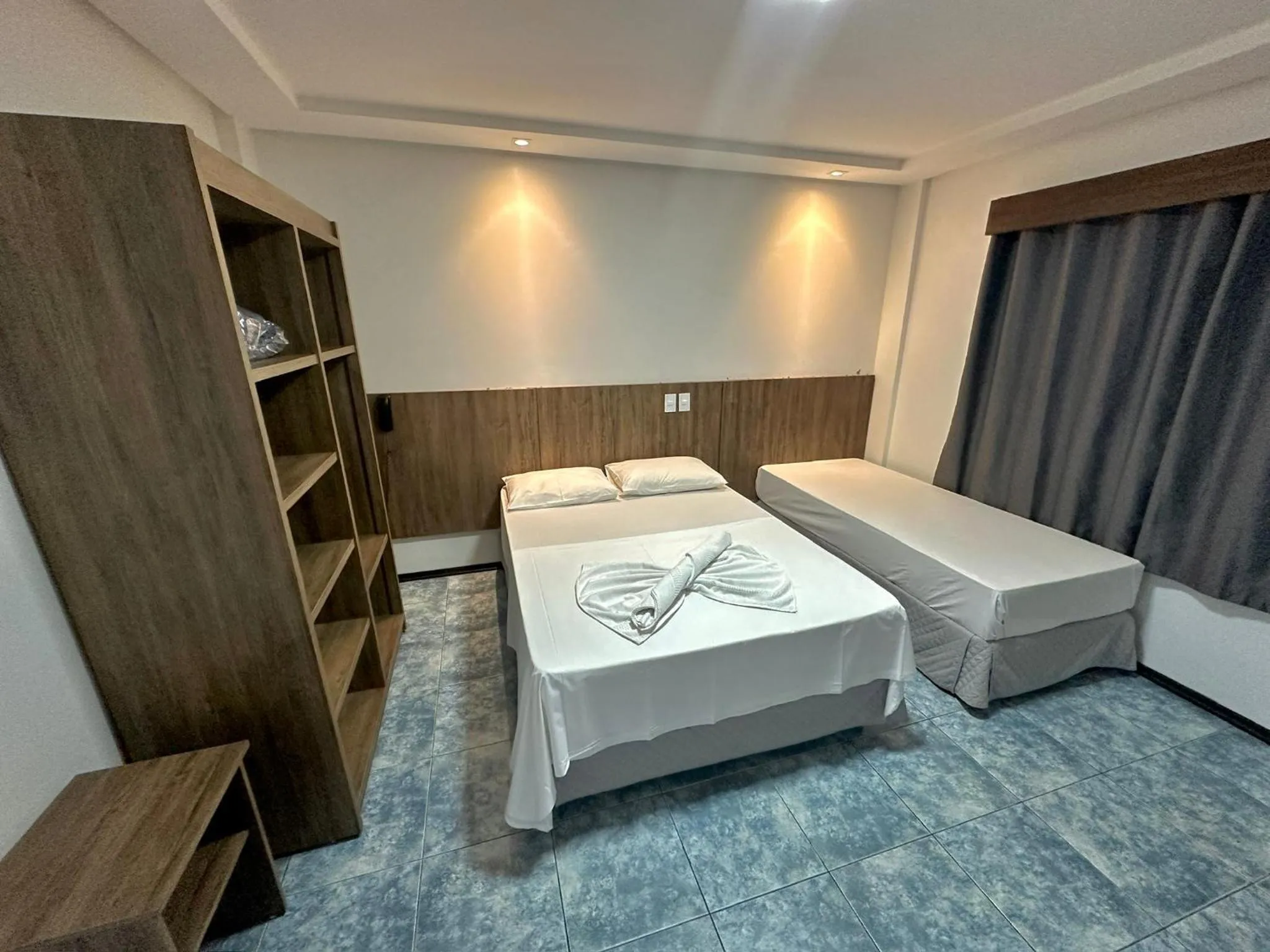 Bed in Hotel Bem Brasil