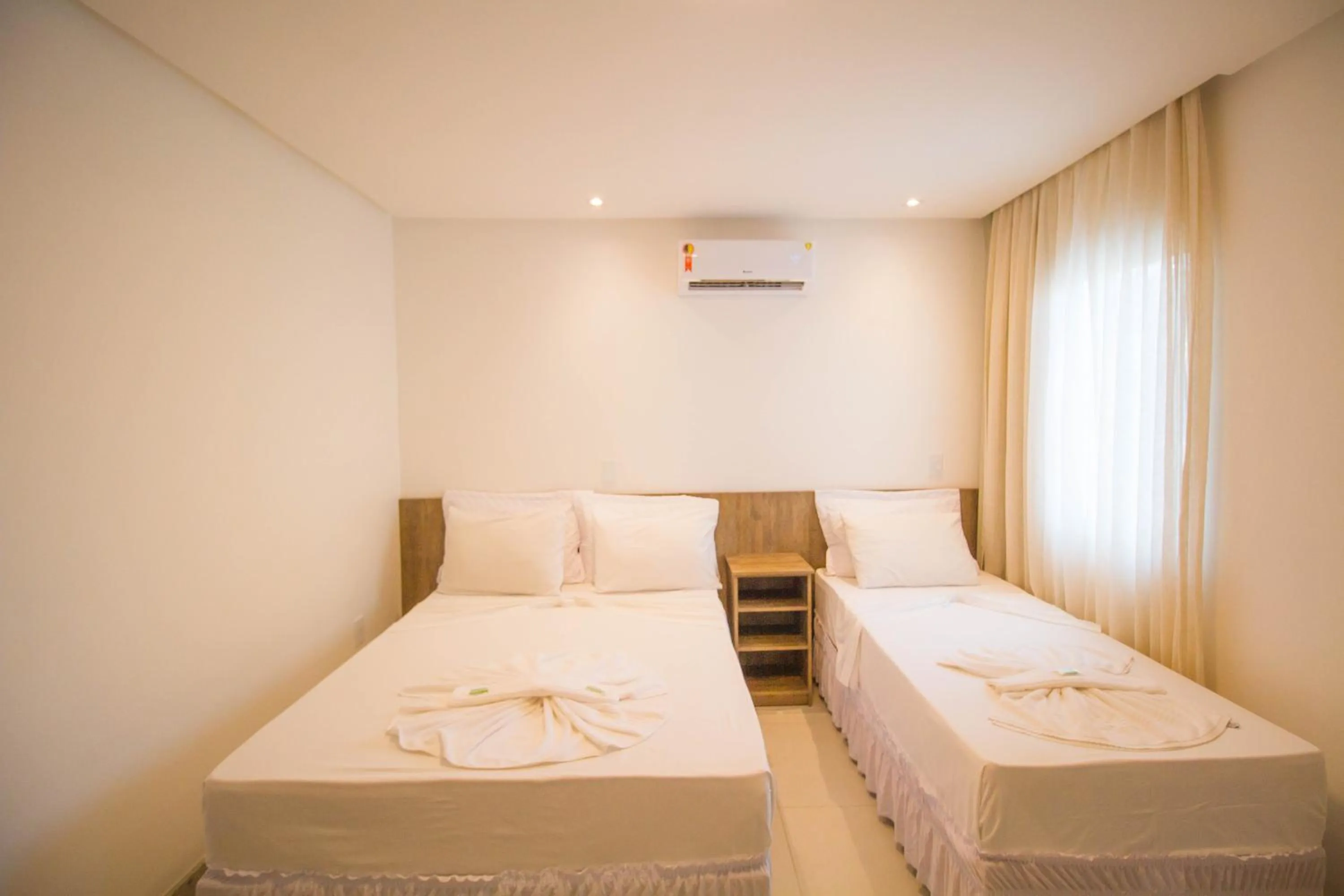 Bed in Hotel Bem Brasil