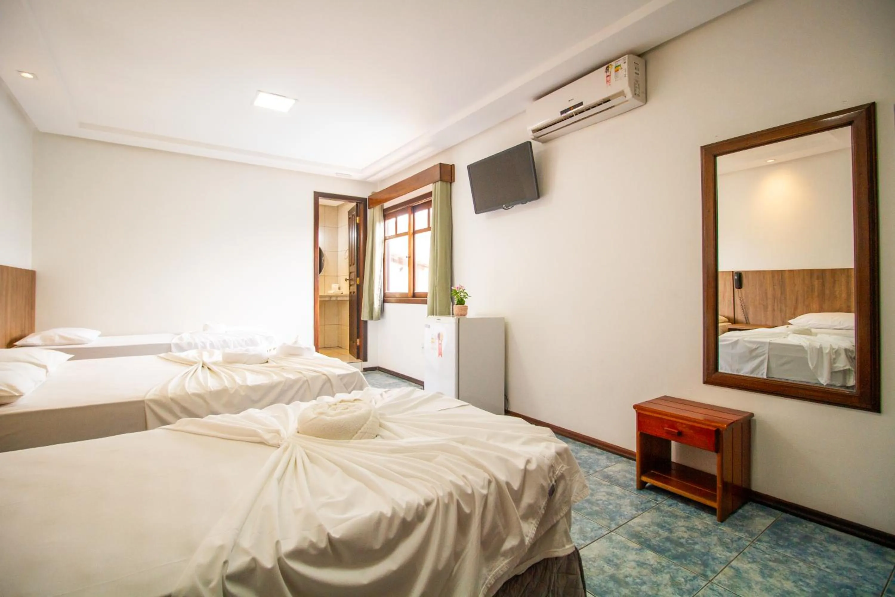 Bed in Hotel Bem Brasil