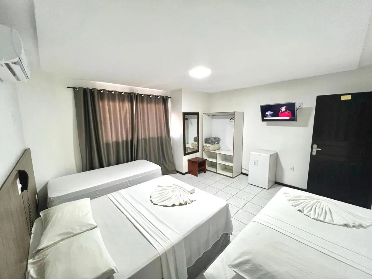 Bed in Hotel Bem Brasil