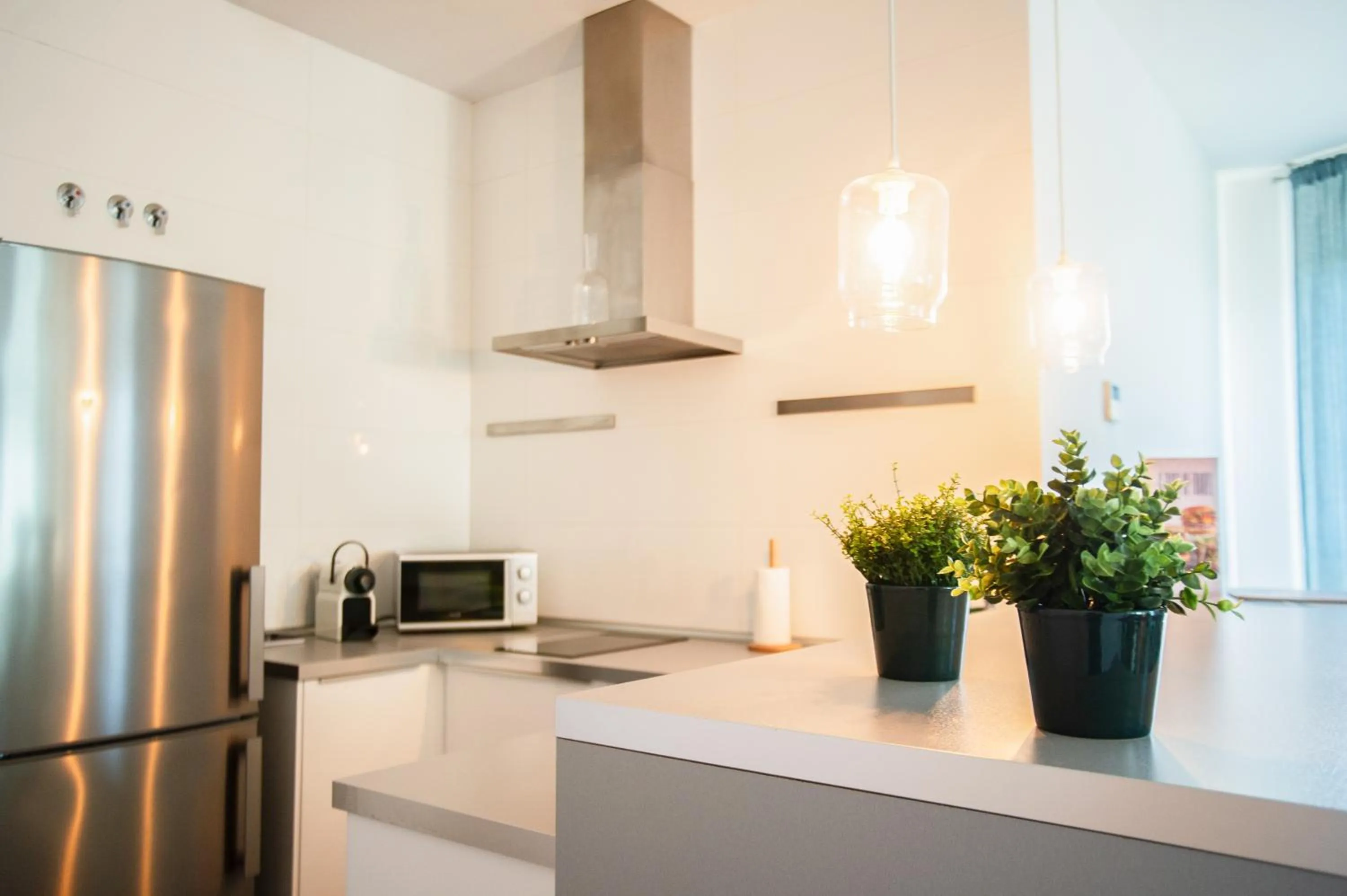 Kitchen or kitchenette in AZZ Sevilla Torre de la Plata Apartamentos