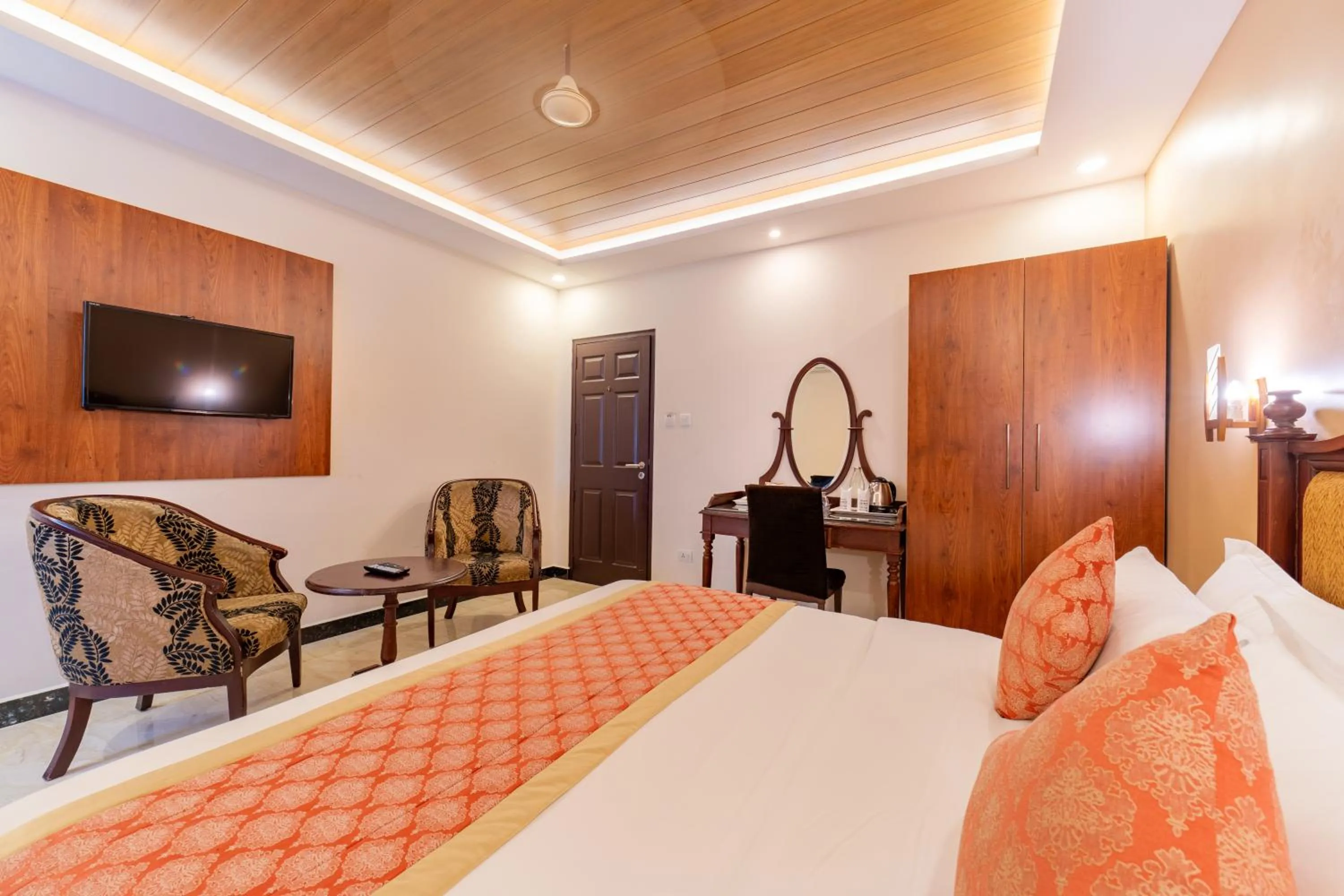 Seating area, Bed in Seasons Thekkady