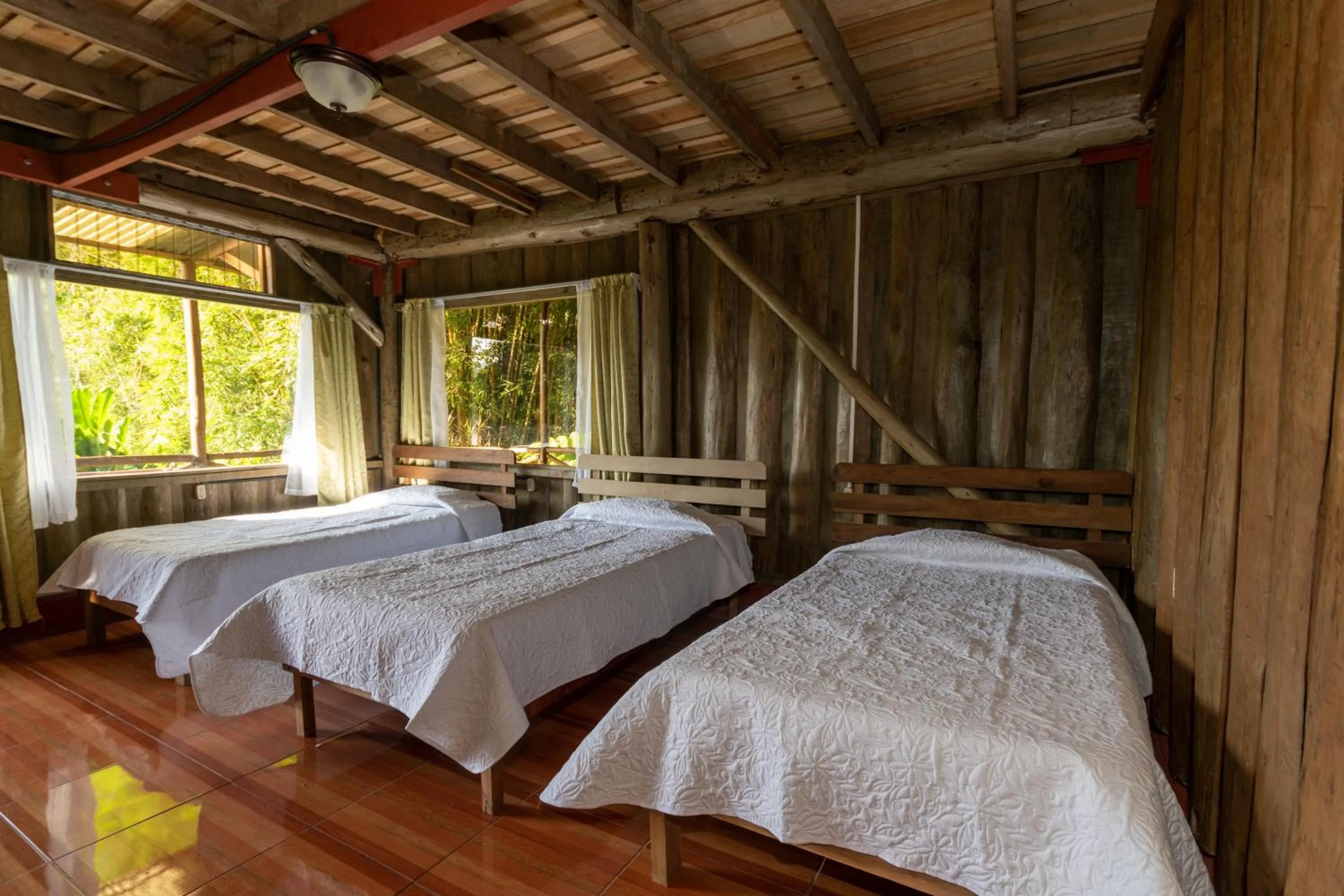 Bed in Vista Turrialba Lodge