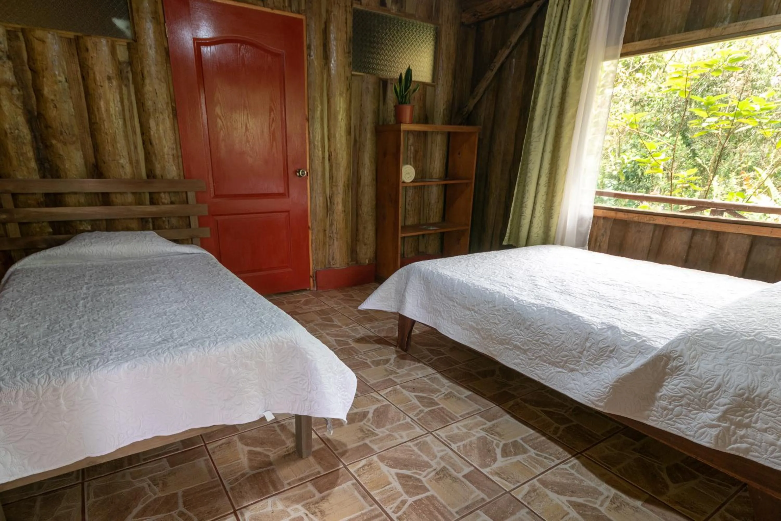 Bed in Vista Turrialba Lodge