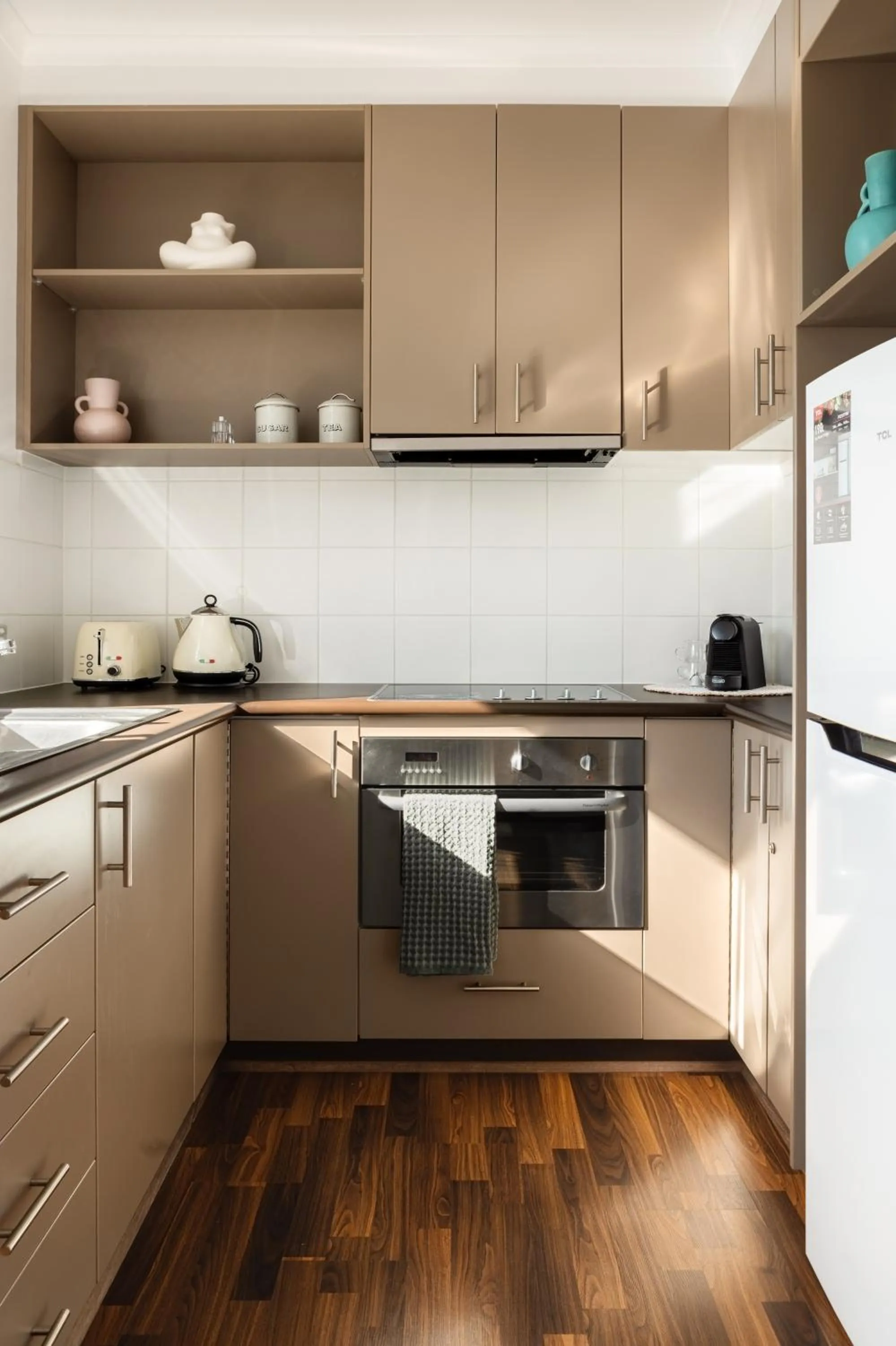 Kitchen or kitchenette in MAC South Yarra by Melbourne Apartment Collection