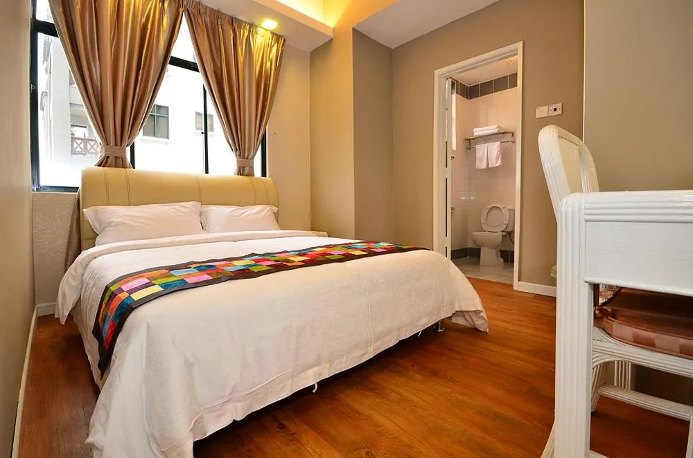 Bed in Jetty Suites Apartments