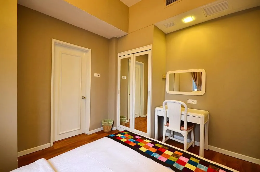 Bed in Jetty Suites Apartments